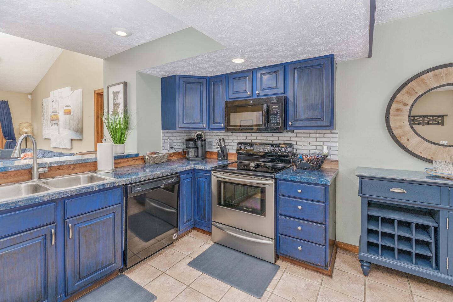 Cook, snack, and gather together in this fully equipped kitchen featuring stainless steel appliances, ample counter space, and a coffee station. Everything your family needs for easy breakfasts, home-cooked dinners, and vacation treats!