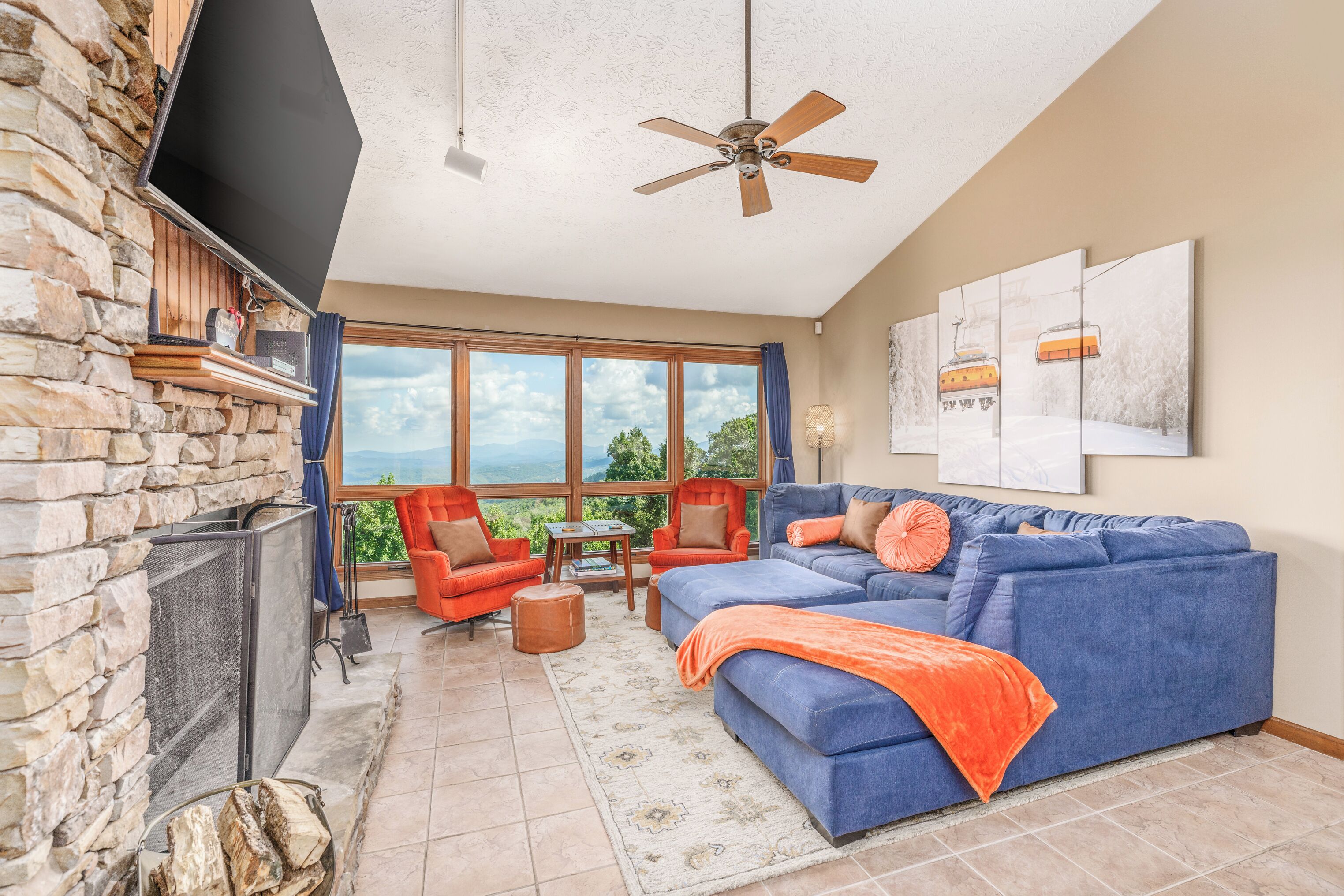Cozy family living room with fireplace and breathtaking Smoky Mountain views.