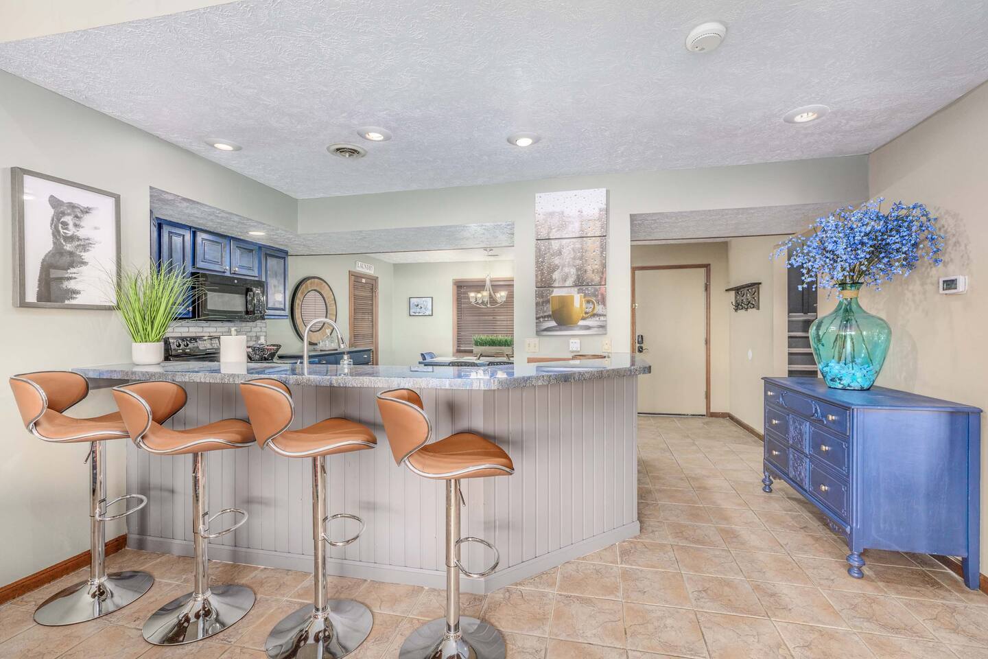 A perfect gathering spot for the family! Pull up a seat at the spacious breakfast bar for morning pancakes, quick snacks, or evening conversations while meals are prepared in the open kitchen. Plenty of seating keeps everyone together!