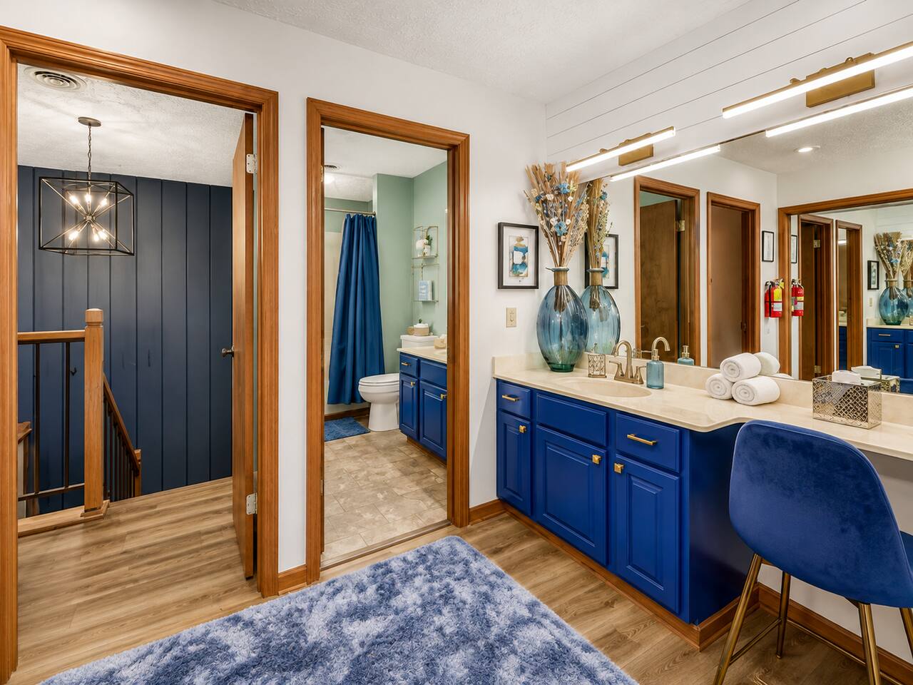 Extra space makes family mornings a breeze! This bright vanity area offers a large mirror, plenty of counter space, and a comfortable getting-ready station—perfect when everyone is preparing for a fun day exploring Gatlinburg and the Smokies.