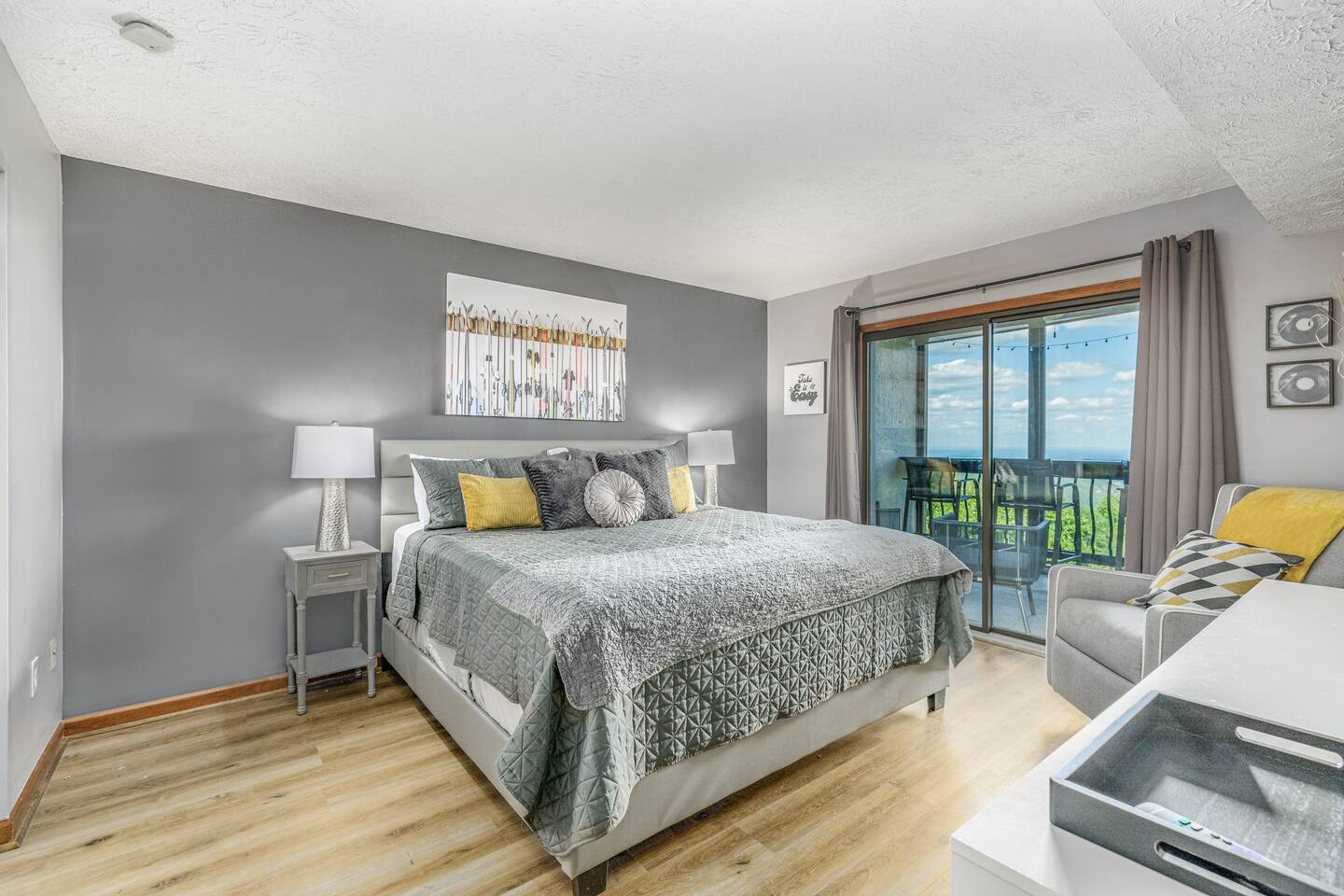 Wake up refreshed in this spacious king bedroom with direct access to a private balcony and beautiful Smoky Mountain views. A cozy sitting area gives parents an extra place to relax while enjoying a peaceful mountain getaway.