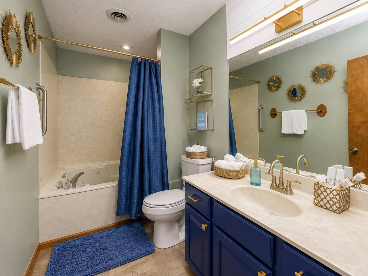 Relax and recharge in this inviting full bathroom featuring a jetted tub, fresh towels, and plenty of vanity space. Perfect for a soothing soak after hiking or for getting the kids cleaned up after a fun-filled day in the Smokies!