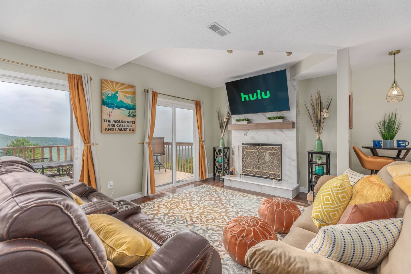 Relax in the inviting living room, featuring a 60" 4K Smart TV with plenty of streaming options. Cozy up by the wood-burning fireplace or simply unwind while taking in the breathtaking mountain views—all from the comfort of your seat.