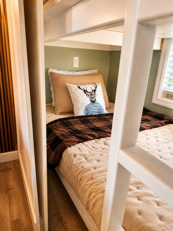 A cozy little sleeping nook designed with families in mind! This tucked-away bed gives younger guests their own fun, comfortable space to relax and recharge after a day of Smoky Mountain adventures.