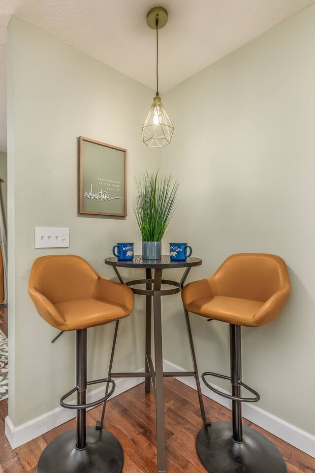 Enjoy a charming bistro dining area just off the kitchen—an elegant spot for morning coffee, intimate meals, or evening wine while taking in the peaceful mountain ambiance.
