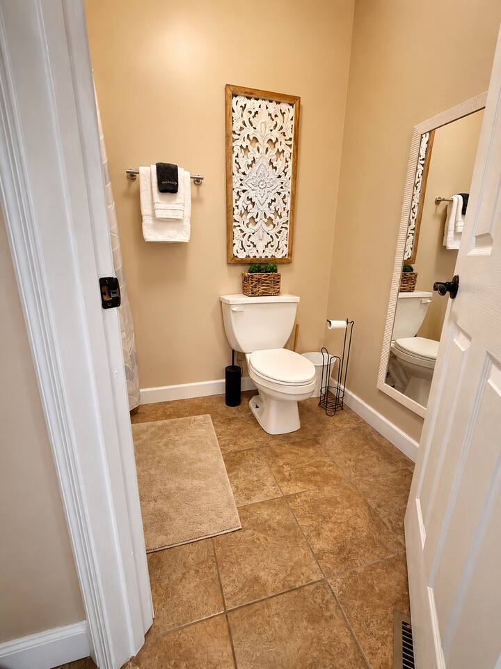 The upstairs bathroom features a spacious walk-in shower, thoughtfully designed with comfort and elegance in mind for a refreshing spa-inspired experience.