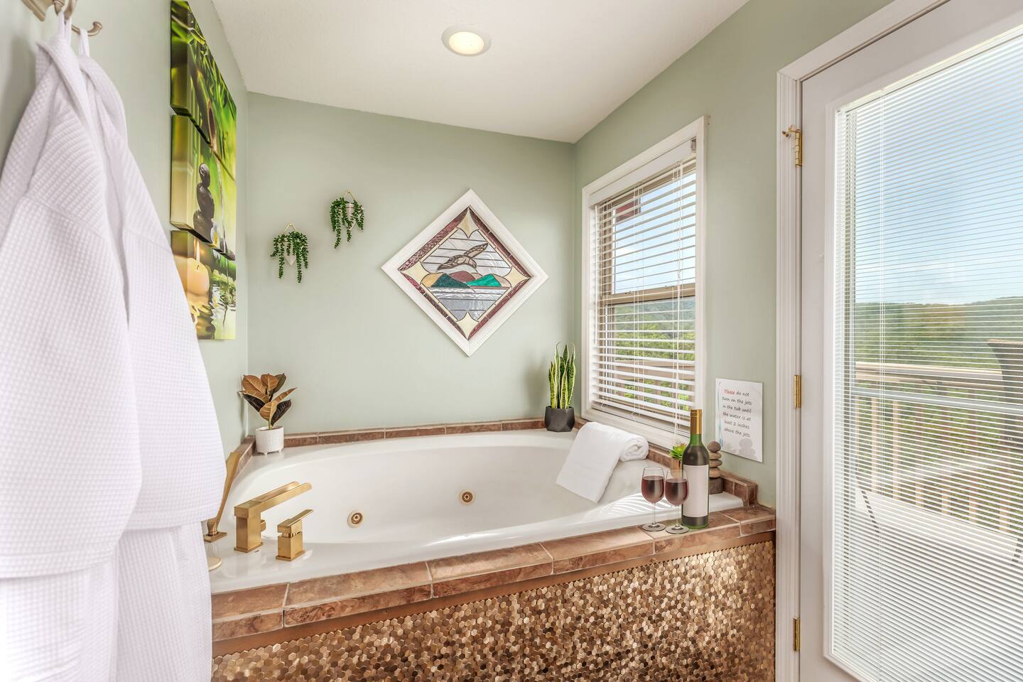 Unwind in the spacious jetted soaking tub in the private master suite, where breathtaking mountain views create a serene, spa-inspired retreat—the perfect place to relax and recharge in luxurious comfort.