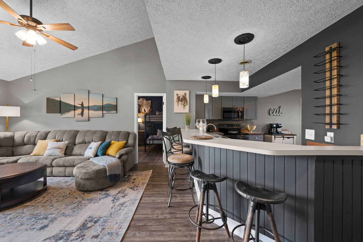 A spacious open-concept layout keeps the whole family together! Relax on the oversized sectional while meals are prepared nearby, or gather around the large breakfast bar for snacks, conversation, and quality time after a fun day in Gatlinburg.