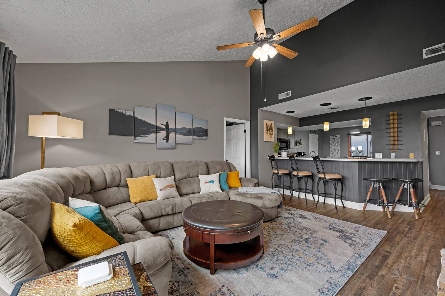 Enjoy family time in this spacious open-concept living area with plenty of comfortable seating and a breakfast bar that keeps everyone connected. Perfect for movie nights, meals, games, and making Smoky Mountain memories together!