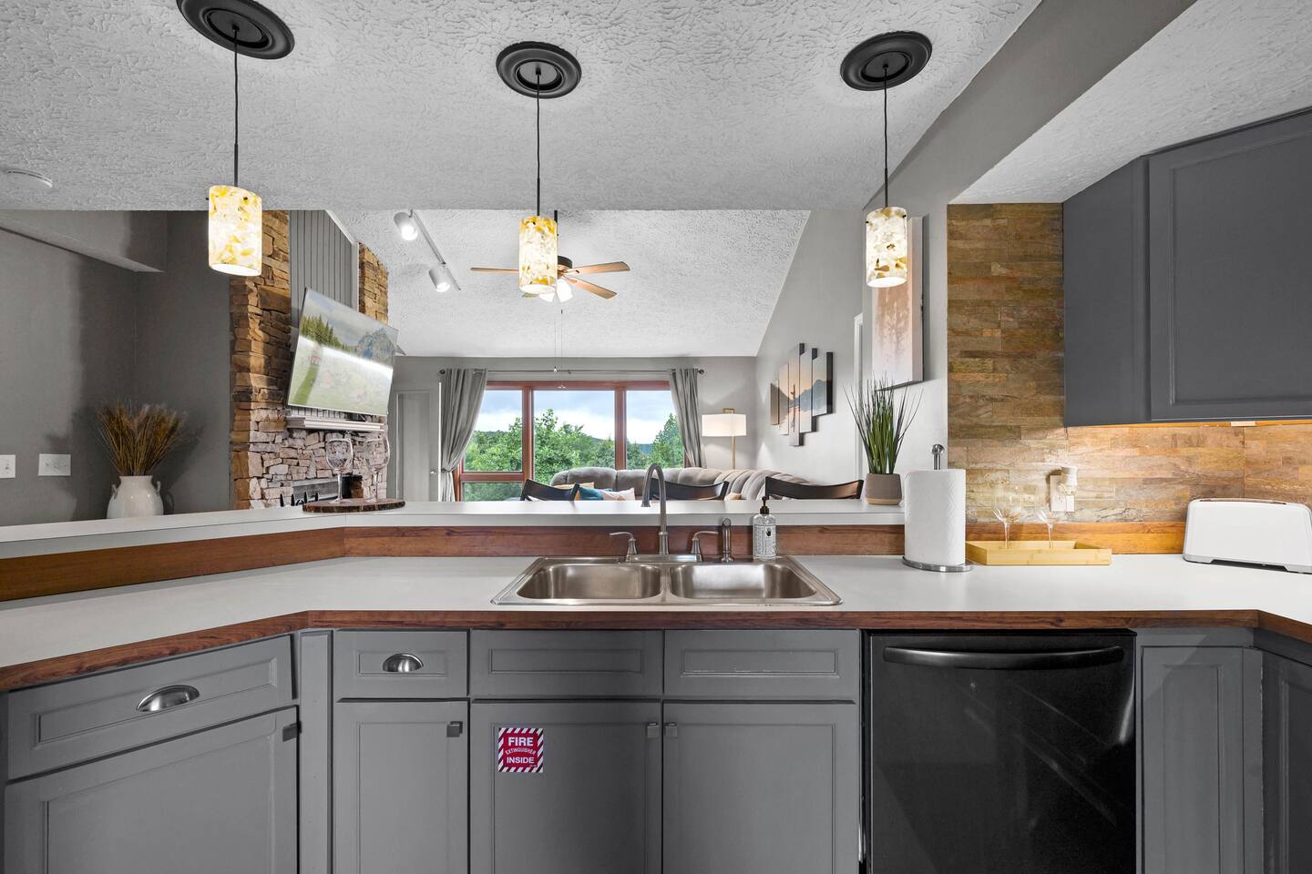 Cook, snack, and stay connected! This open kitchen overlooks the cozy living room and mountain views, making it easy for parents to prepare meals while still being part of the family fun. A perfect setup for your Gatlinburg getaway!