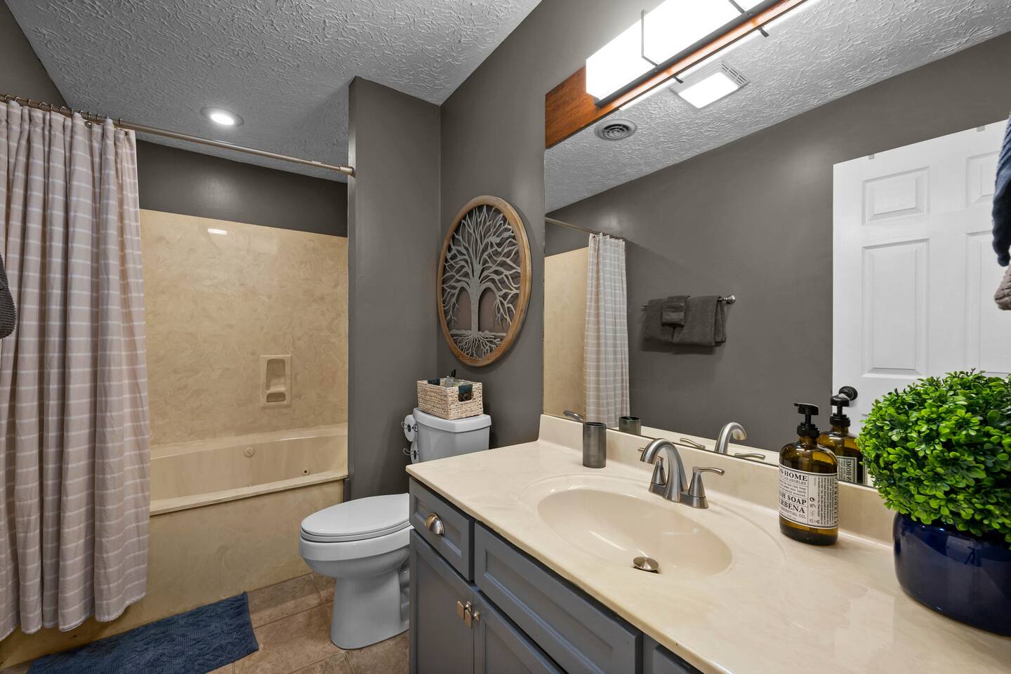 Attached bathroom to upstairs suite with whirlpool tub and shower