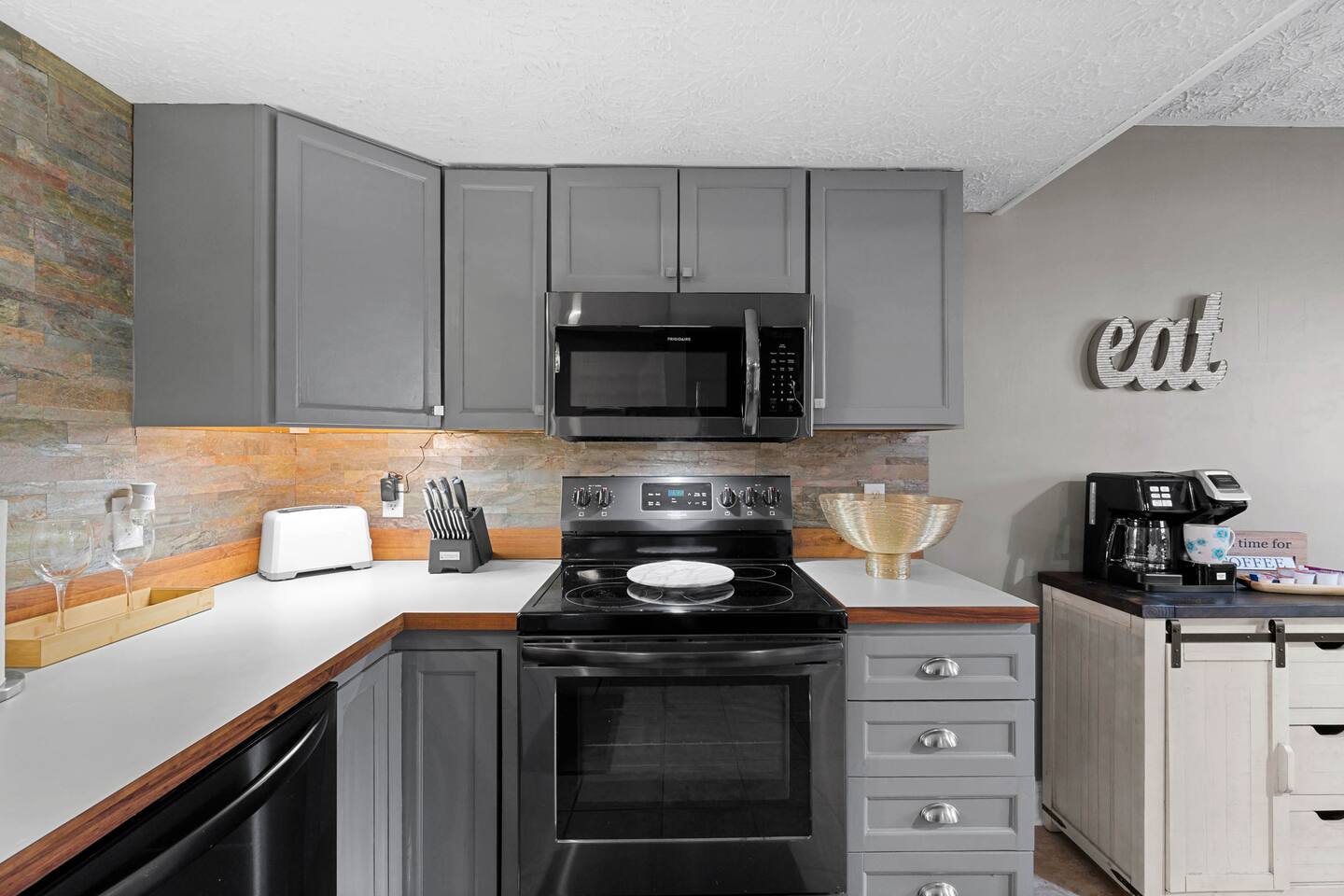 Make family meals easy in this well-equipped kitchen featuring full-size appliances, plenty of prep space, and a dedicated coffee station—perfect for quick breakfasts before exploring Gatlinburg or cozy dinners at home.
