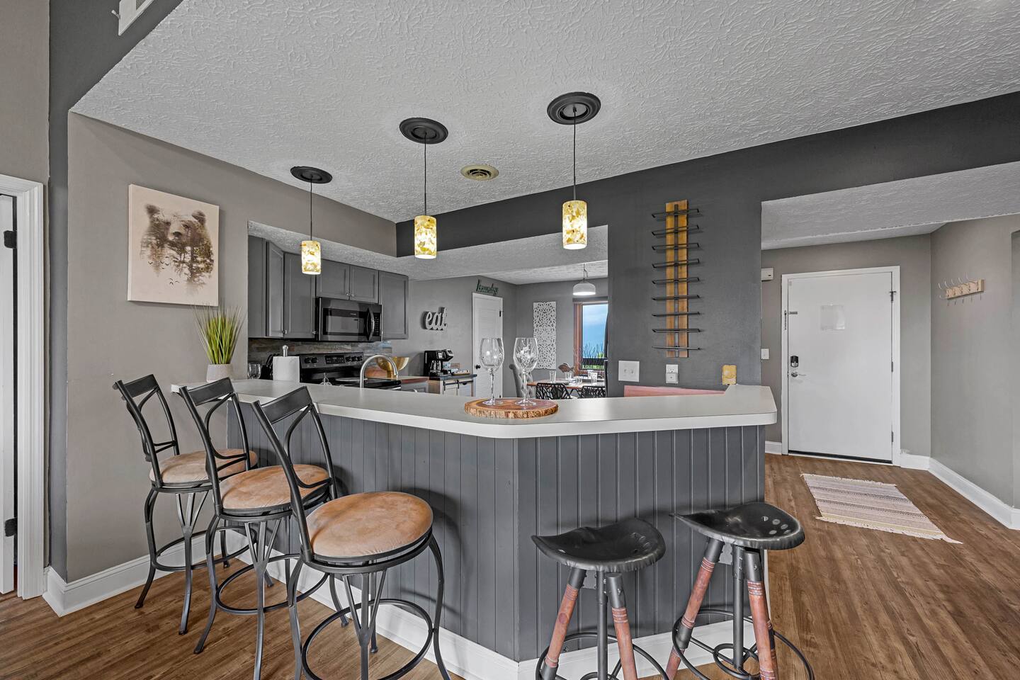 Gather around the spacious kitchen bar for breakfast, snacks, or family game time! With plenty of seating and an open layout connecting the kitchen and living area, everyone can stay together while making vacation memories.