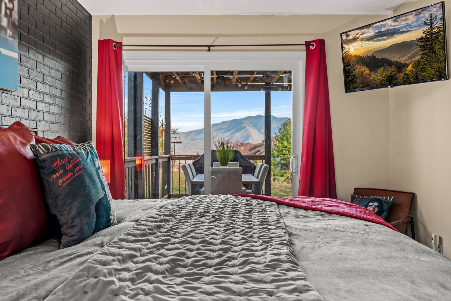 Wake up to breathtaking Smoky Mountain views from this peaceful master bedroom! Step through the sliding doors onto your private deck, sip your morning coffee, or relax in bed and enjoy the mountain scenery.