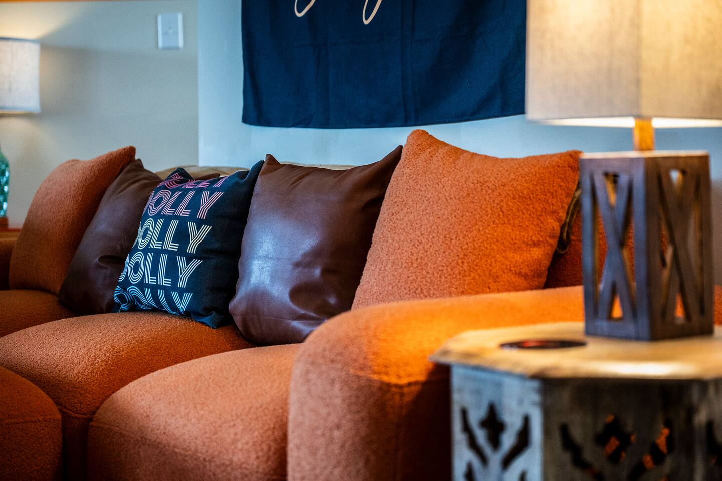 A cozy sitting area perfect for relaxing between family adventures! Sink into the comfy sofa, enjoy the warm lighting, and take in the playful Dolly-inspired details that add extra personality to your Smoky Mountain stay.
