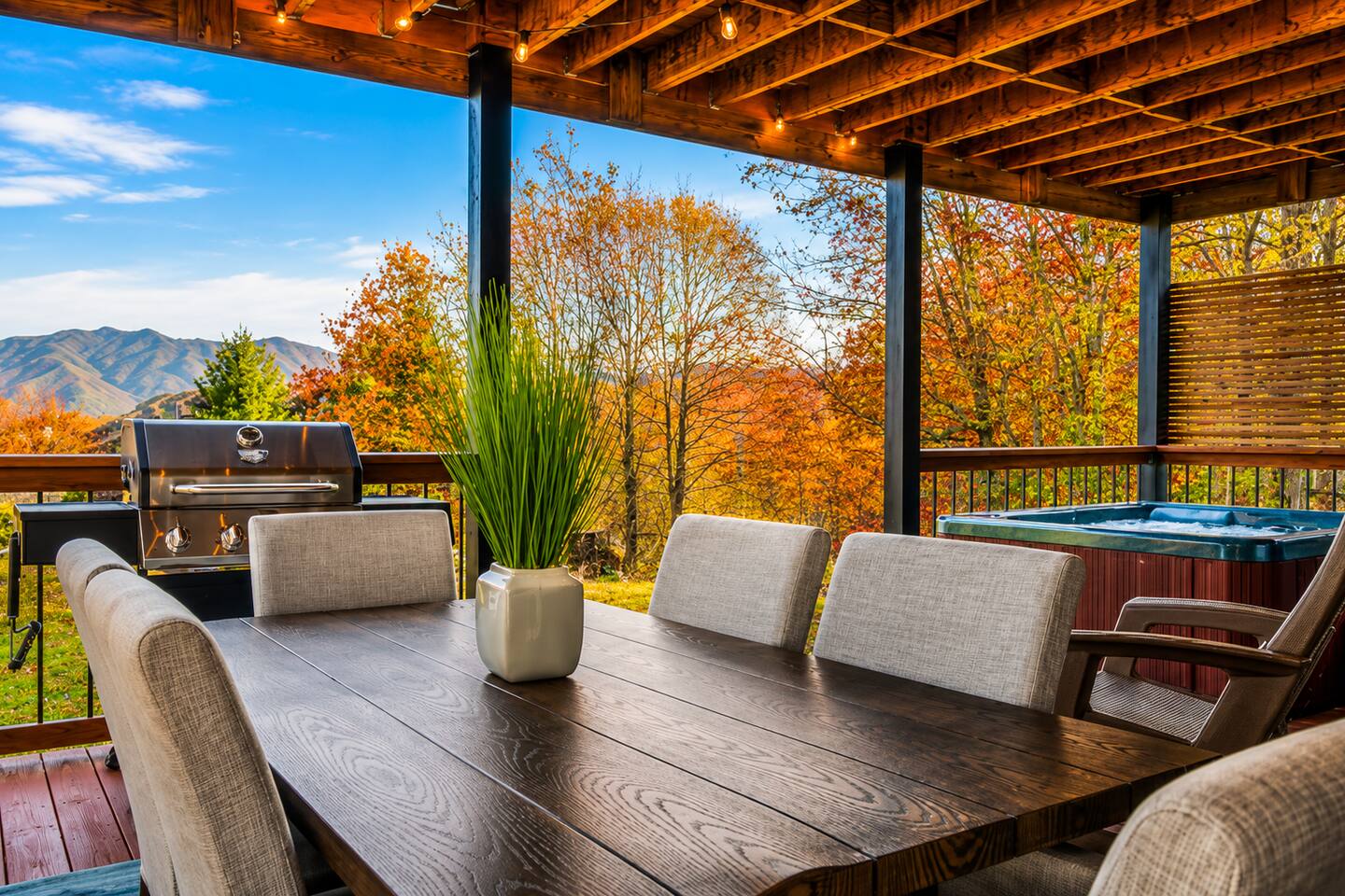 Gather the family for meals with a view! Enjoy outdoor dining, and a relaxing hot tub—all under a covered deck surrounded by gorgeous fall colors and breathtaking Smoky Mountain scenery.