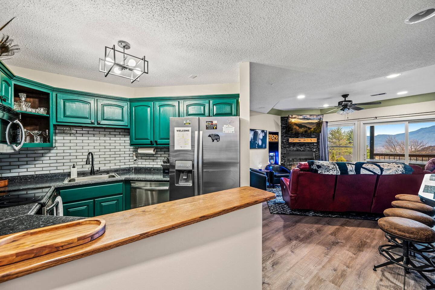 The open-concept kitchen makes family time easy! Prepare favorite meals while staying connected with everyone in the living room, all while enjoying beautiful mountain views just beyond the windows.