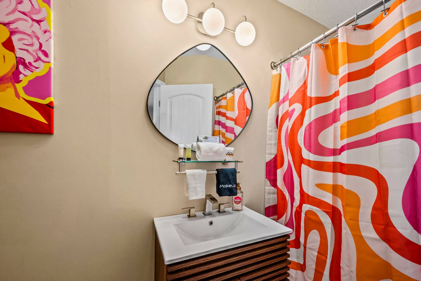 A bright, cheerful bathroom adds a fun pop of color to your family getaway, with a spacious vanity and tub/shower combo—perfect for getting everyone ready for another exciting day in the Smokies!