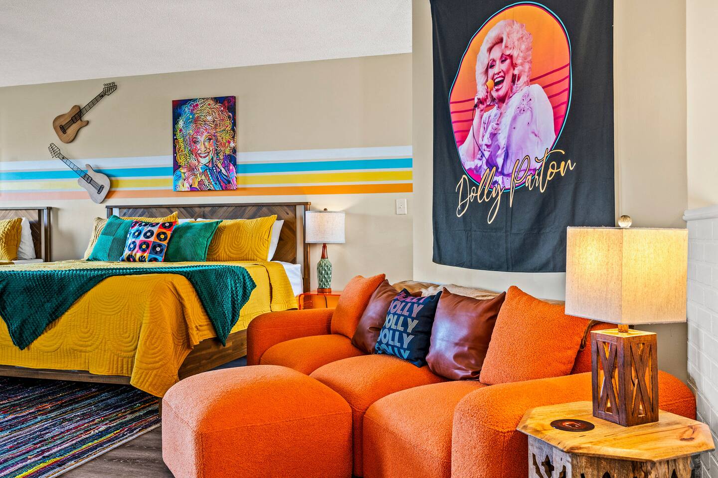 A cozy sitting area adds extra space for the family to relax and unwind! Enjoy colorful music-inspired décor, comfortable seating, and a fun Dolly Parton touch that brings plenty of Smoky Mountain personality to your stay.