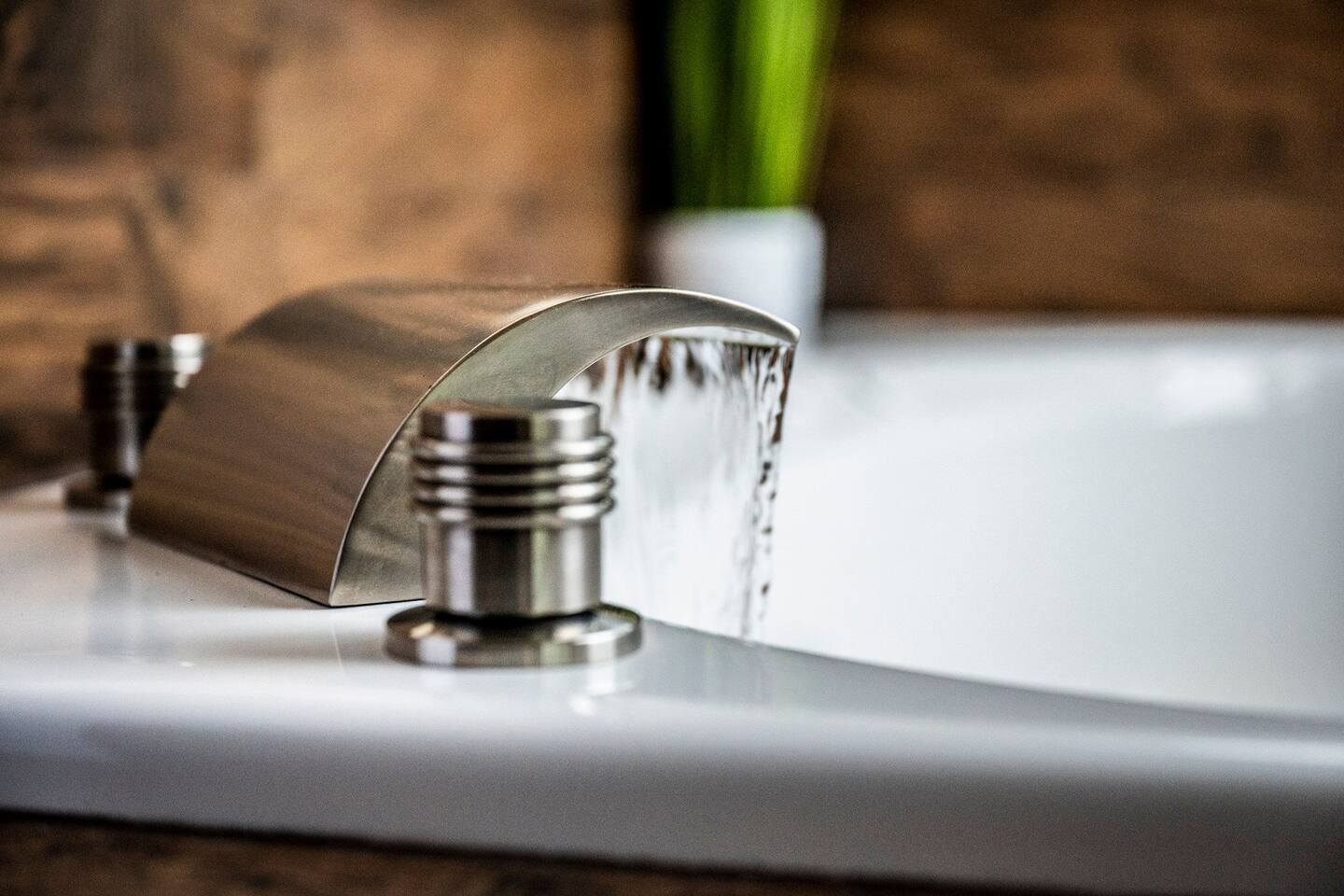 Enjoy a relaxing soak in the jetted tub, complete with a beautiful waterfall faucet—the perfect way for parents to unwind after a memorable family day exploring the Smoky Mountains.