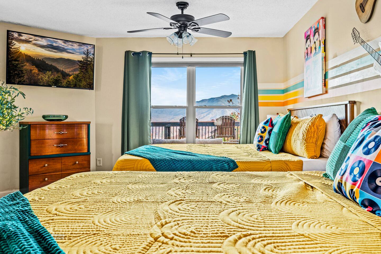 A bright, cheerful bedroom perfect for kids or family members! With two comfy king size beds, a Smart TV, playful music-inspired décor, and beautiful Smoky Mountain views, everyone has a fun place to relax and recharge.