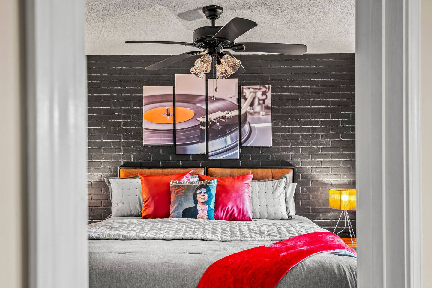 A stylish music-themed bedroom with a cozy, inviting feel! Parents can relax in comfort while enjoying the fun record-inspired décor—a peaceful retreat after a memorable day exploring Gatlinburg with the family.