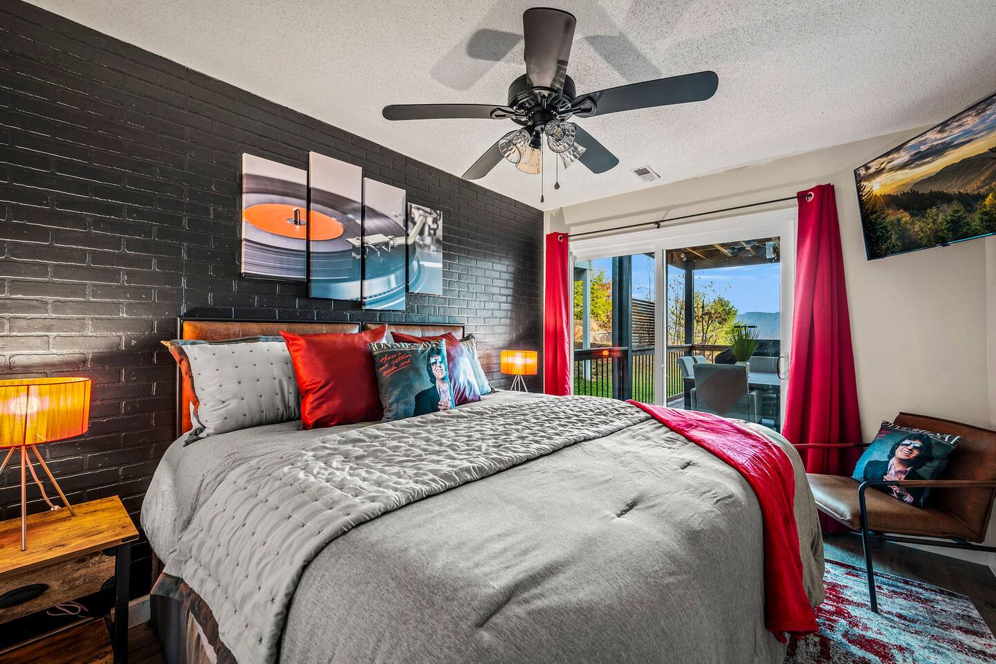 A spacious, music-inspired bedroom where parents can relax and recharge. Enjoy cozy bedding, a Smart TV, and direct deck access—perfect for stepping outside to enjoy the fresh Smoky Mountain air and peaceful views.