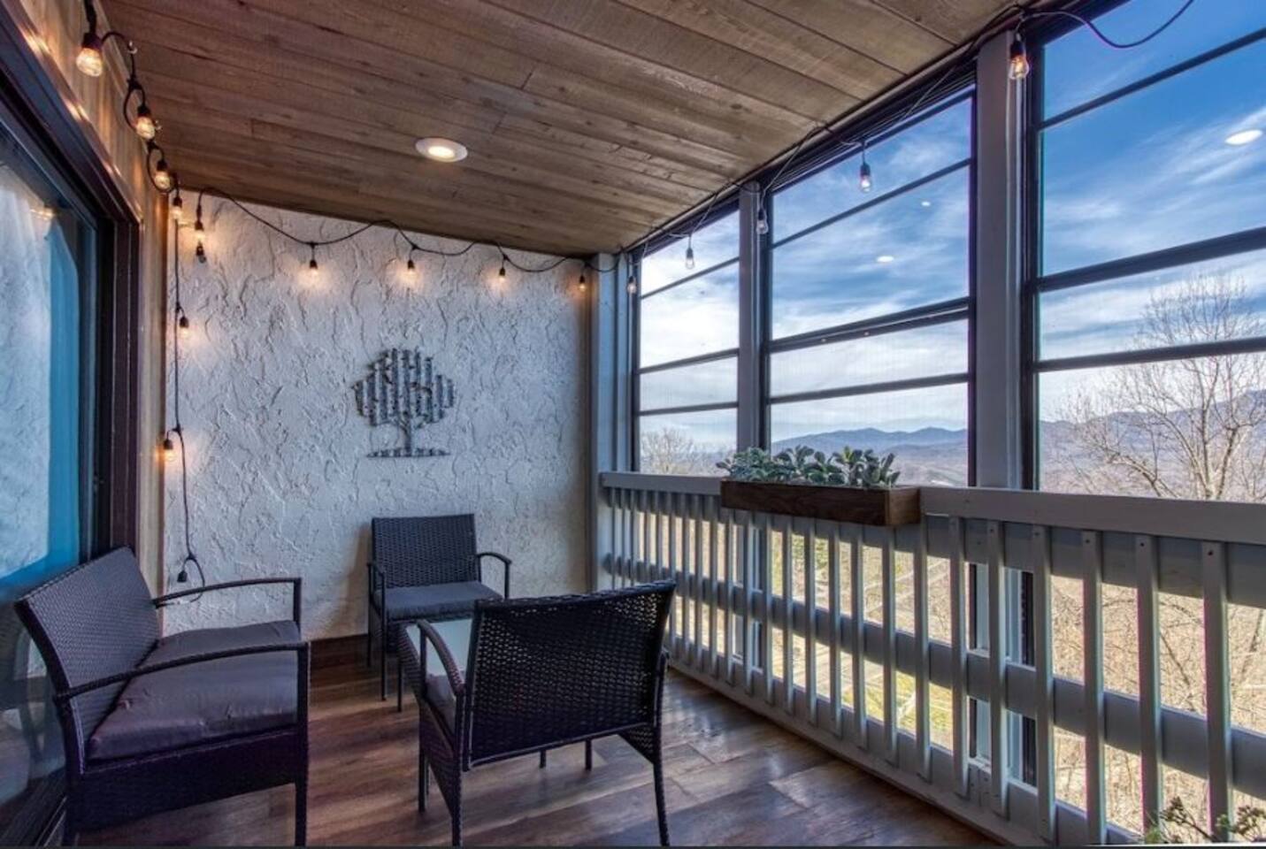 An indoor/outdoor porch that allows you to enjoy the mountain air.