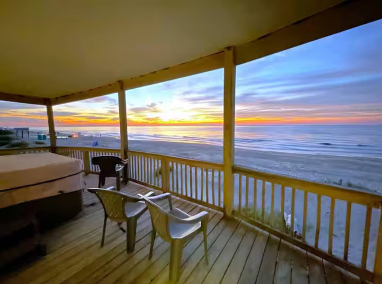 Tide & Tub &mdash; covered oceanfront deck at sunset, Surfside Beach