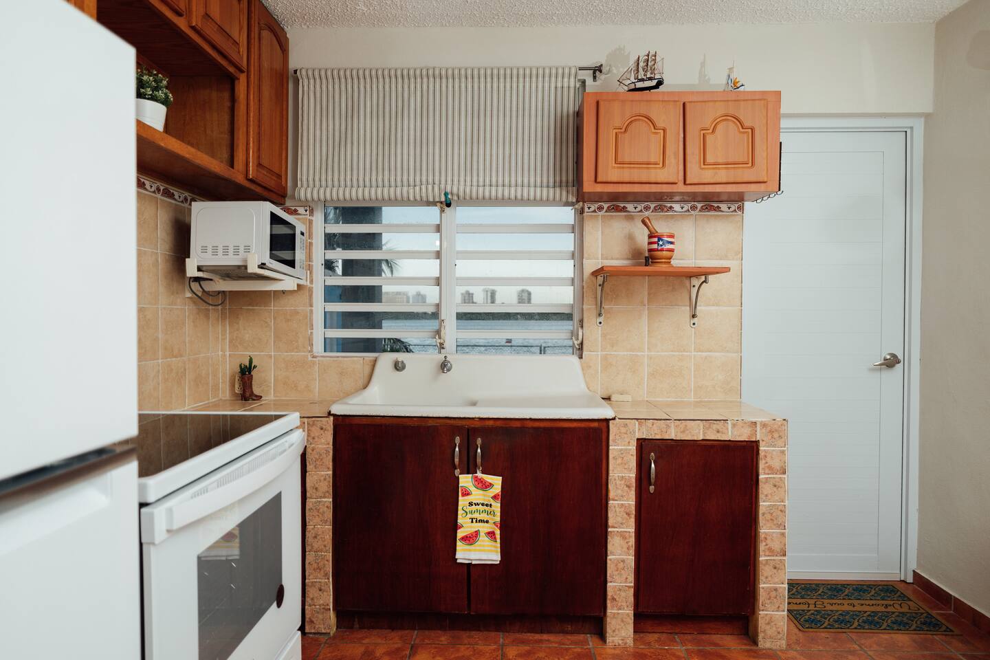 Full Kitchen with epic Isla Verde skyline. Enjoy a time away while cooking with this amazing comfy family home.