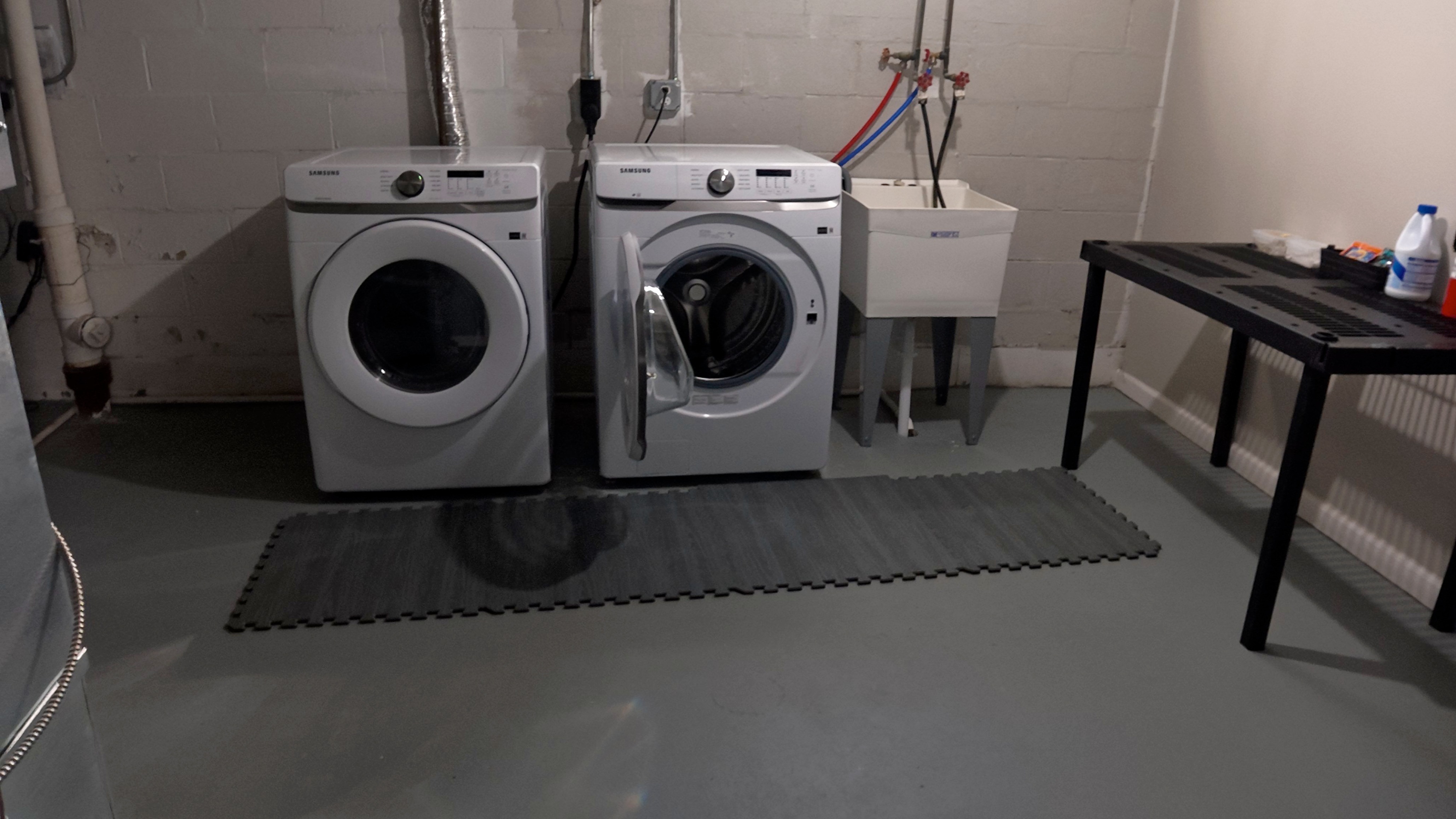 Convenient in-home laundry room with washer, dryer & utility sink