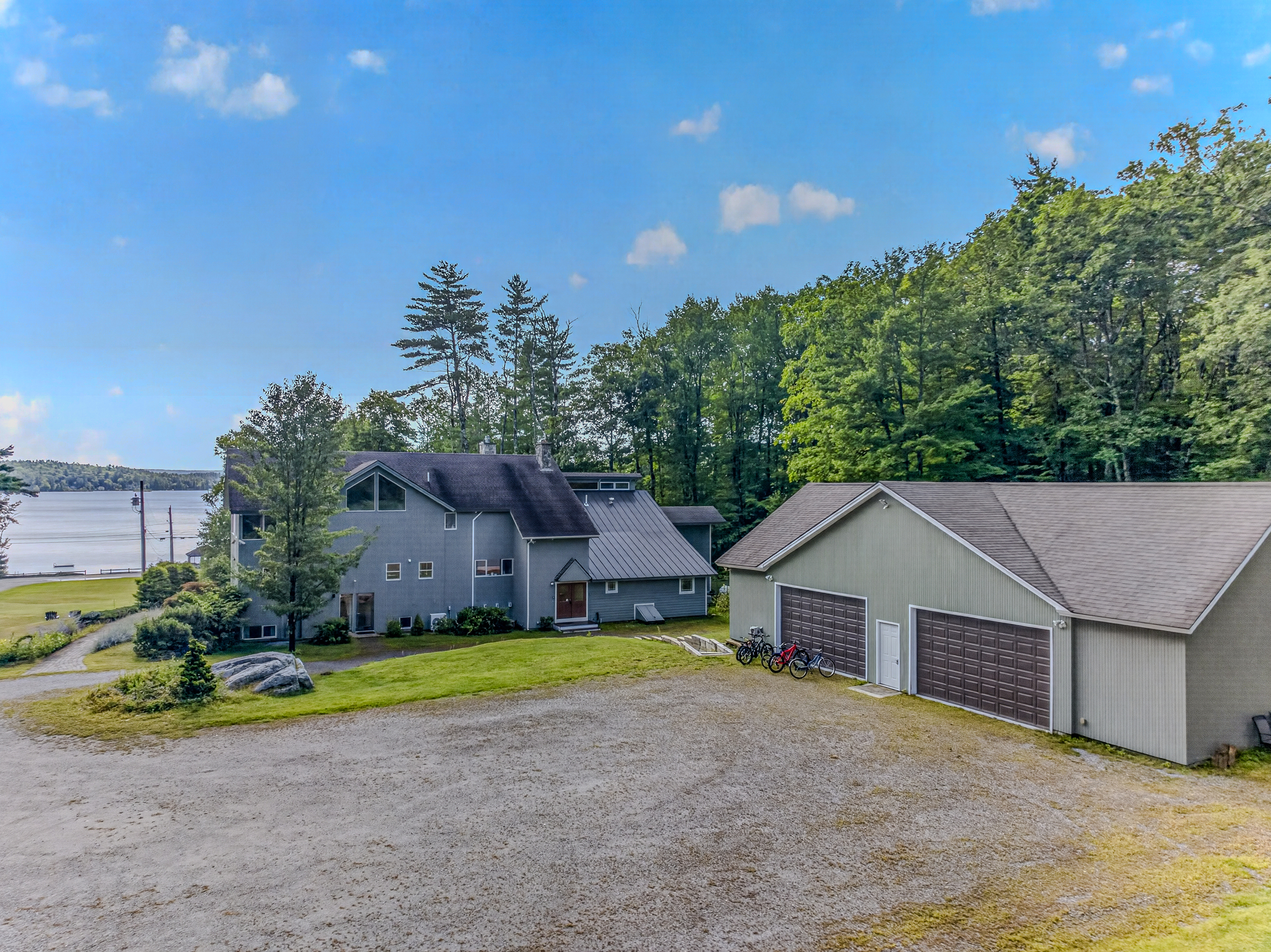 Peaceful lakeside retreat with spacious grounds and detached garage