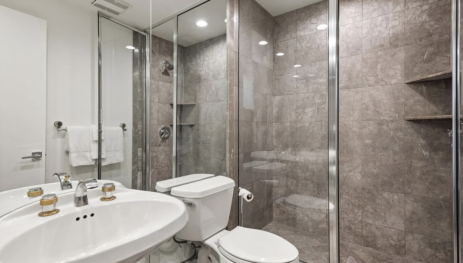 Modern tiled bathroom with sleek glass walk-in shower