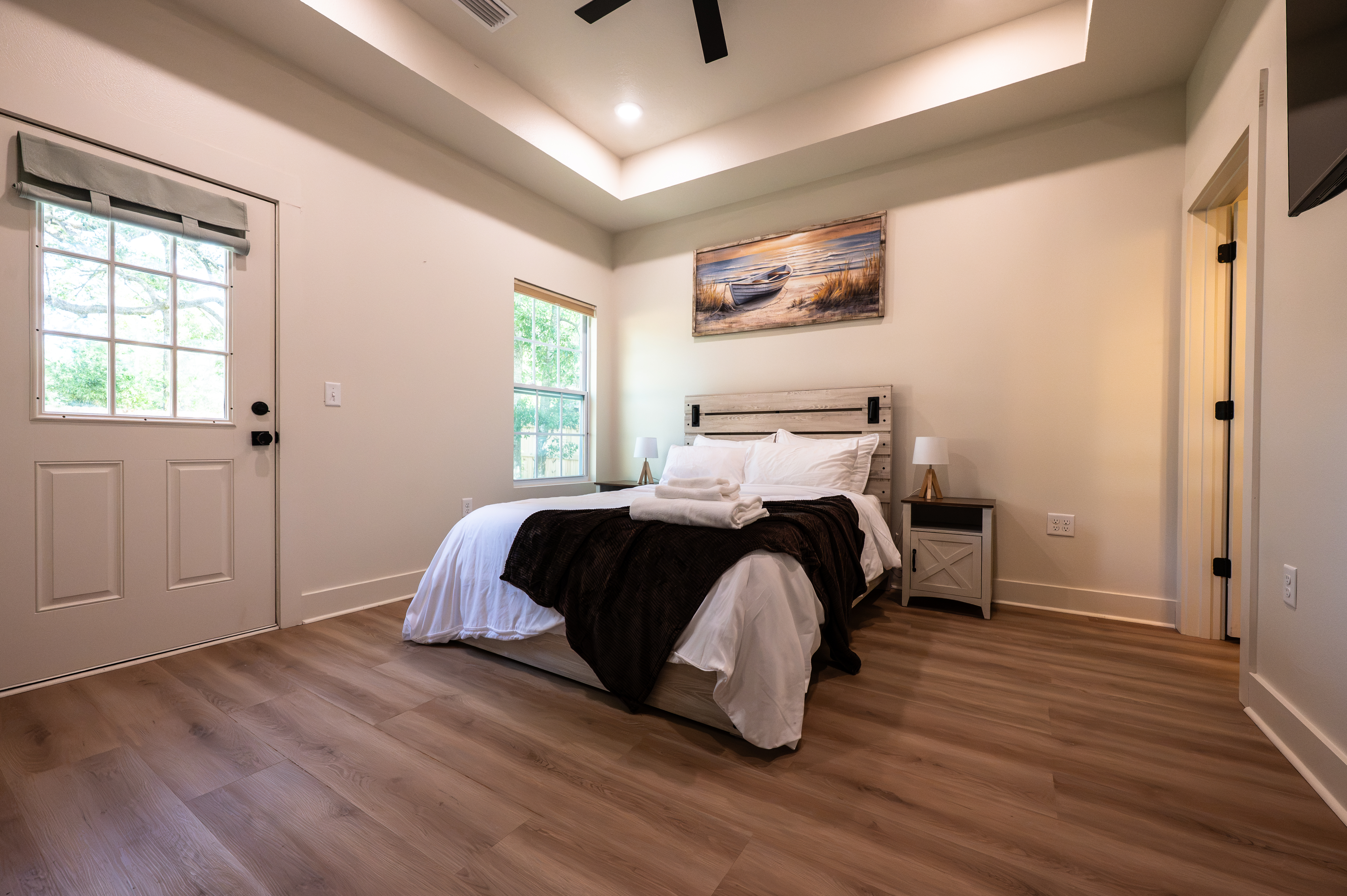 Bright modern bedroom with private entrance and airy, spacious feel
