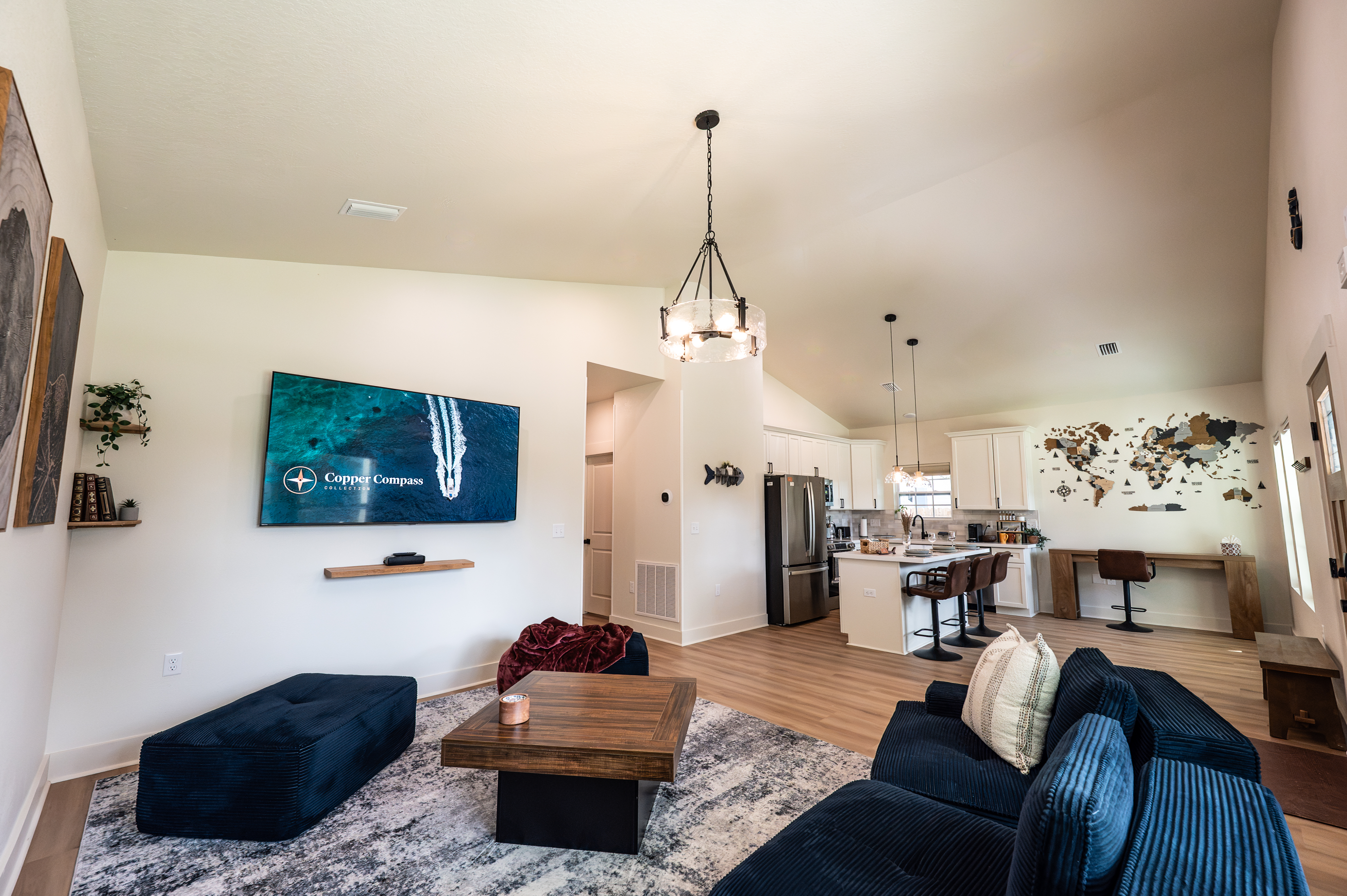 Open-concept living space with kitchen and seating at the Pensacola house