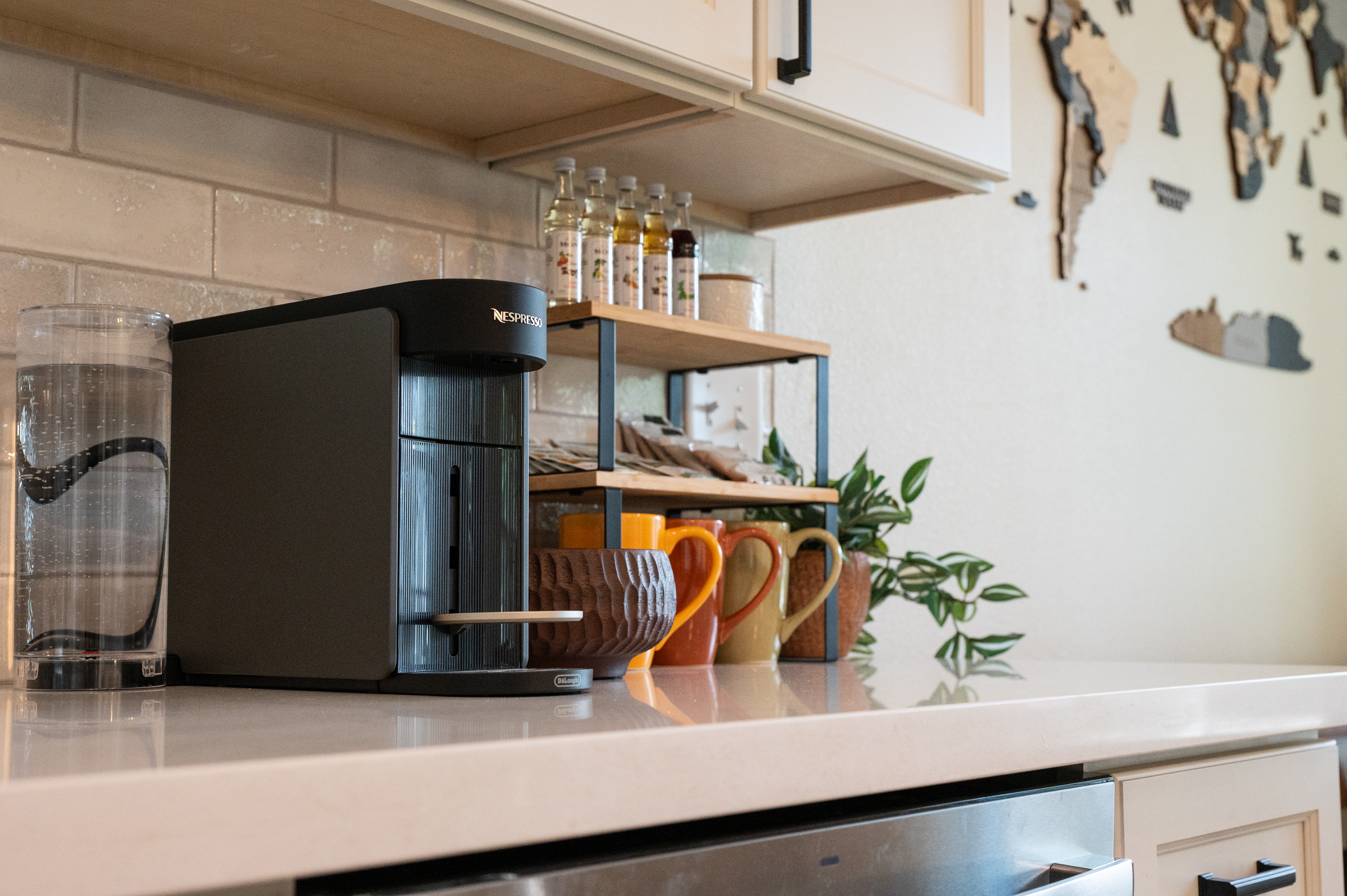 Chic coffee station with Nespresso, mugs, and modern kitchen styling