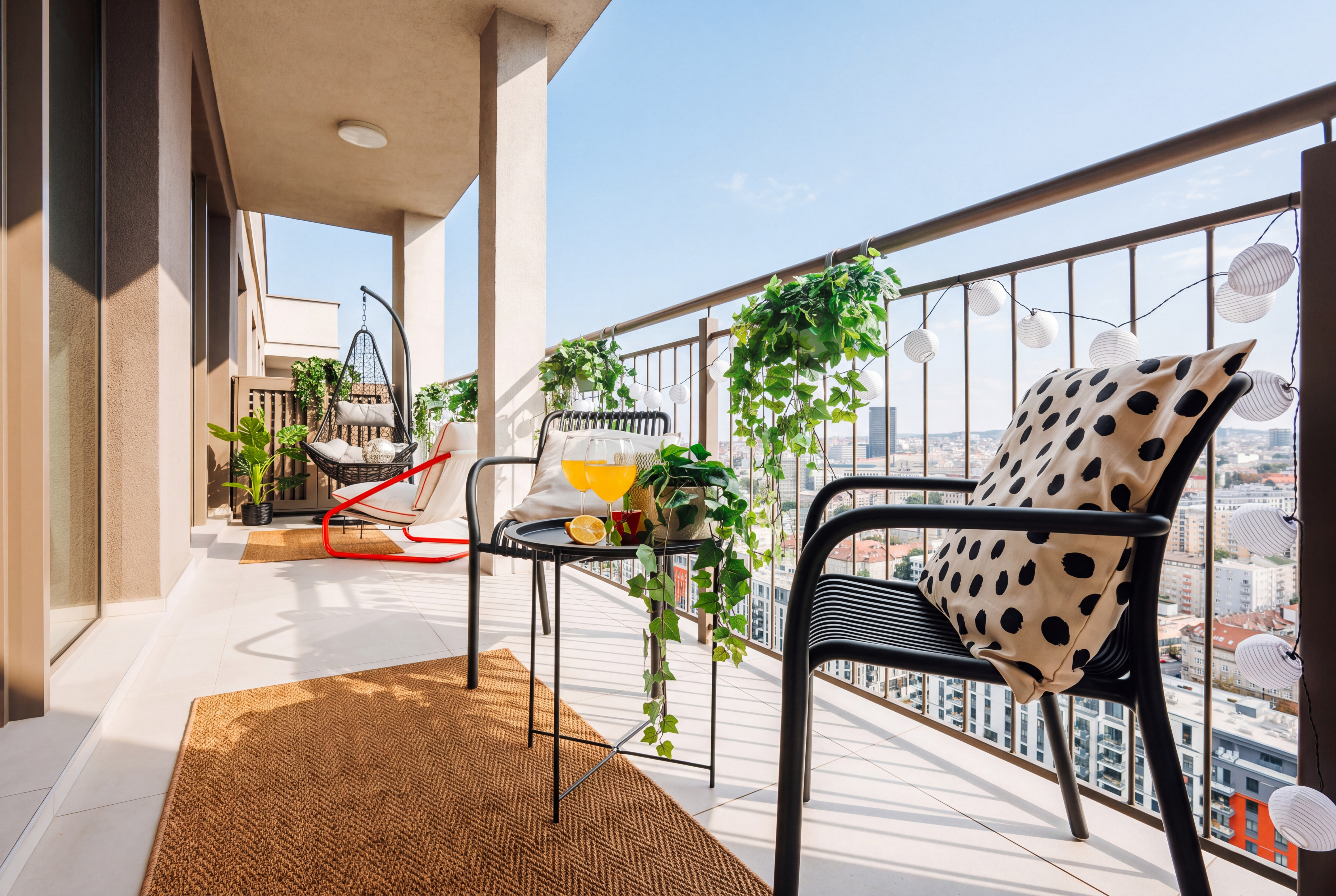 Spacious skyline balcony with chic seating and relaxing city views