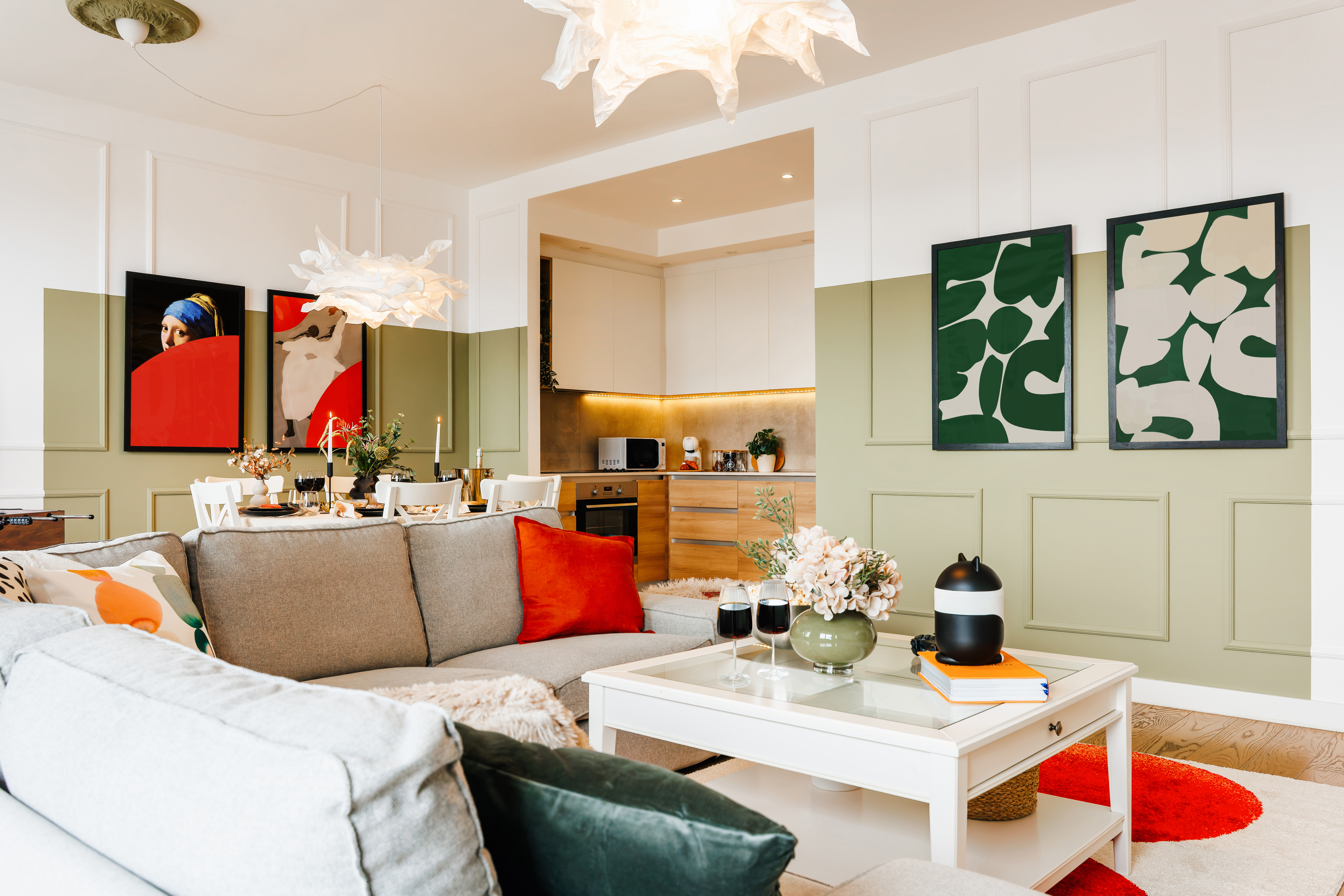 Stylish open-plan lounge with designer lighting and a modern kitchen