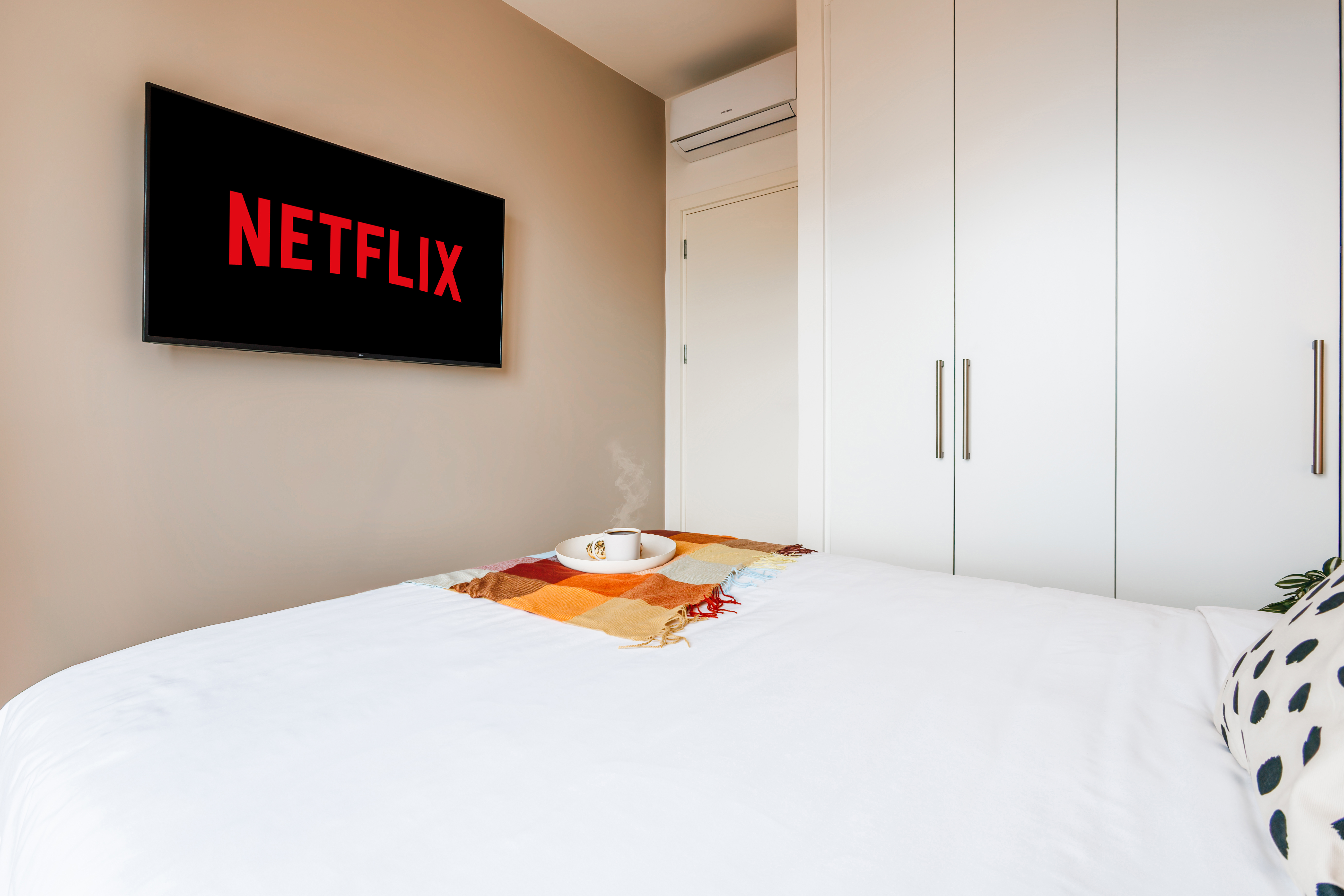 Cozy modern bedroom with Netflix, A/C, and spacious built-in storage
