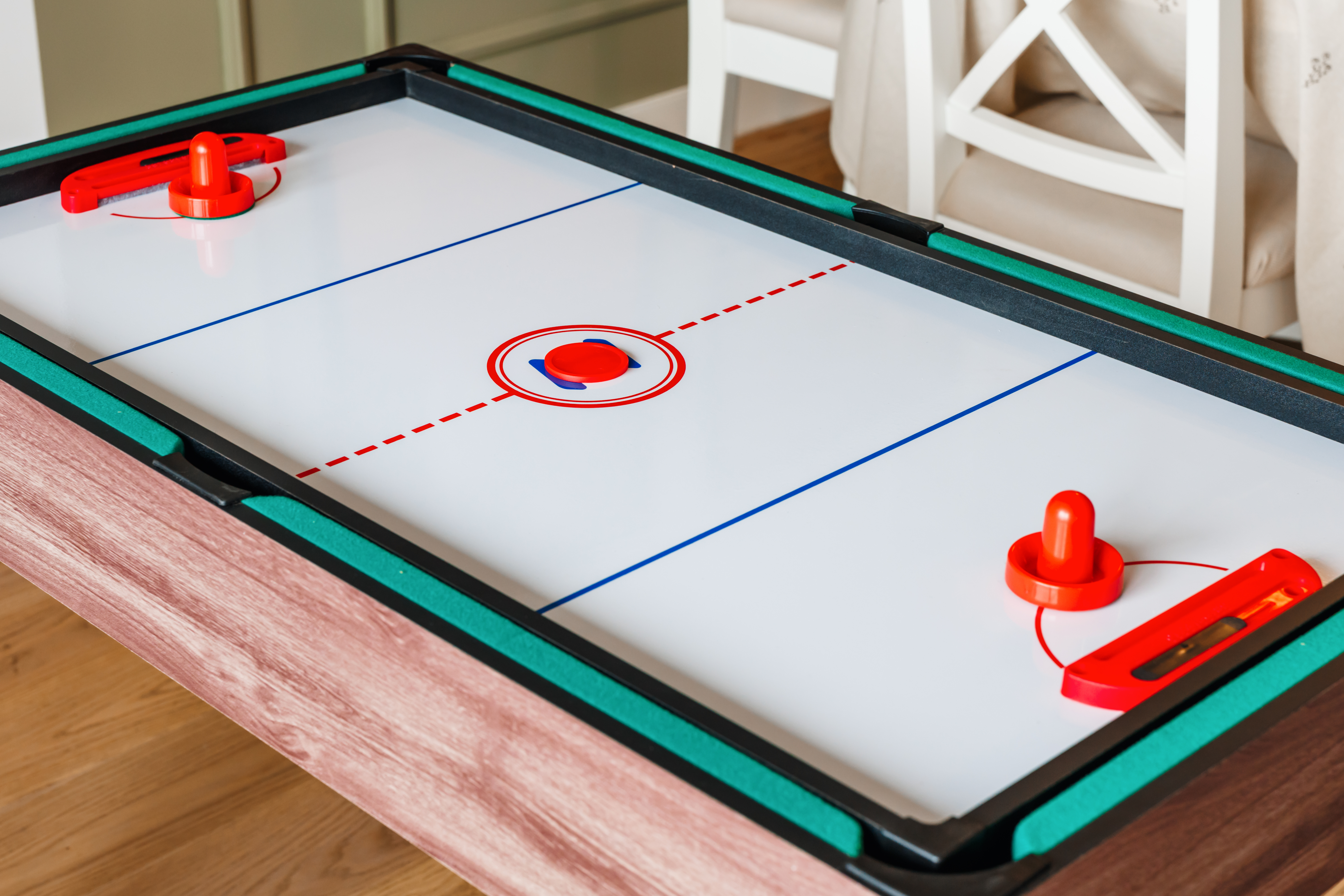 Tabletop air hockey adds a fun, family-friendly game night feature