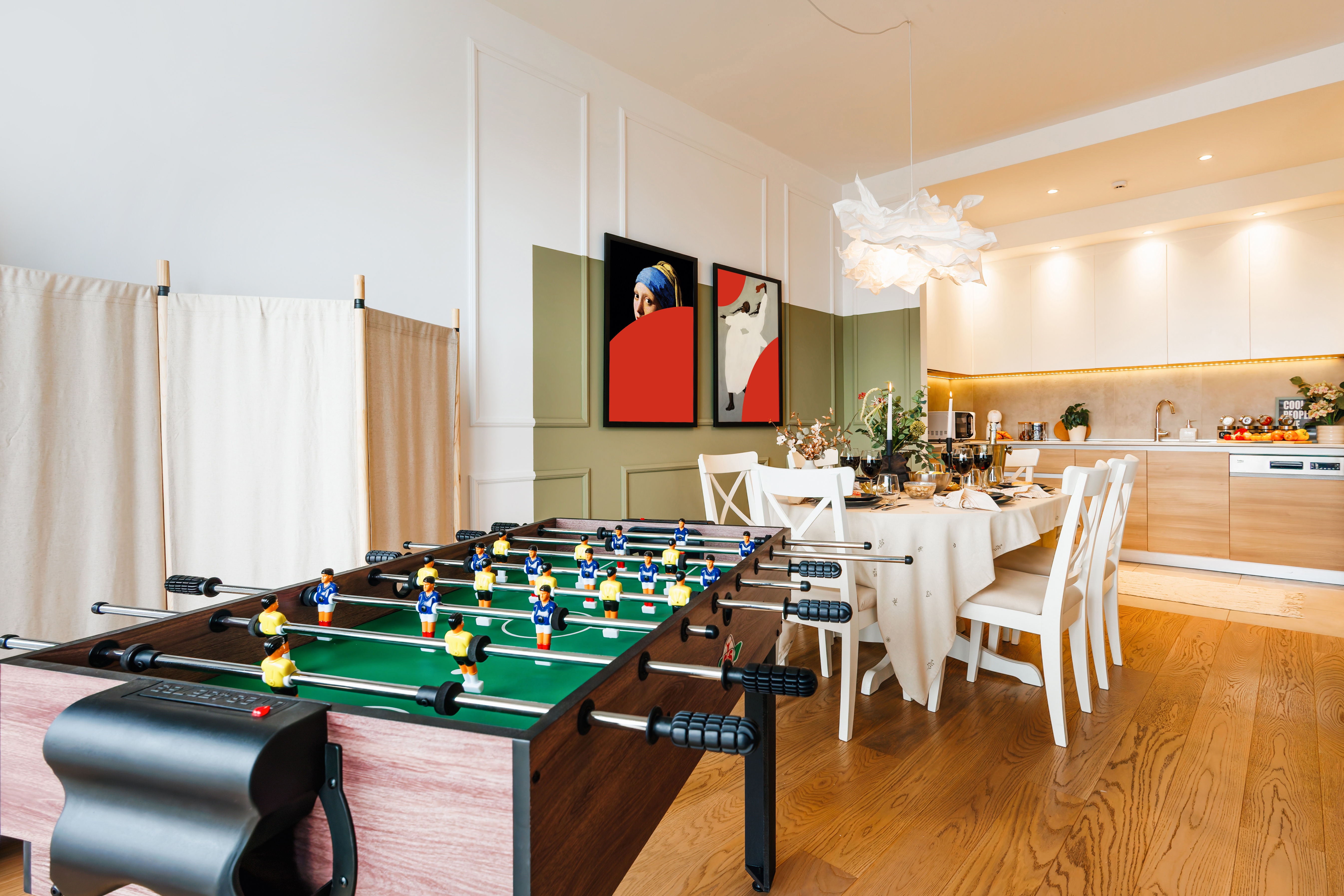 Modern open-plan kitchen, dining area & foosball for fun group stays