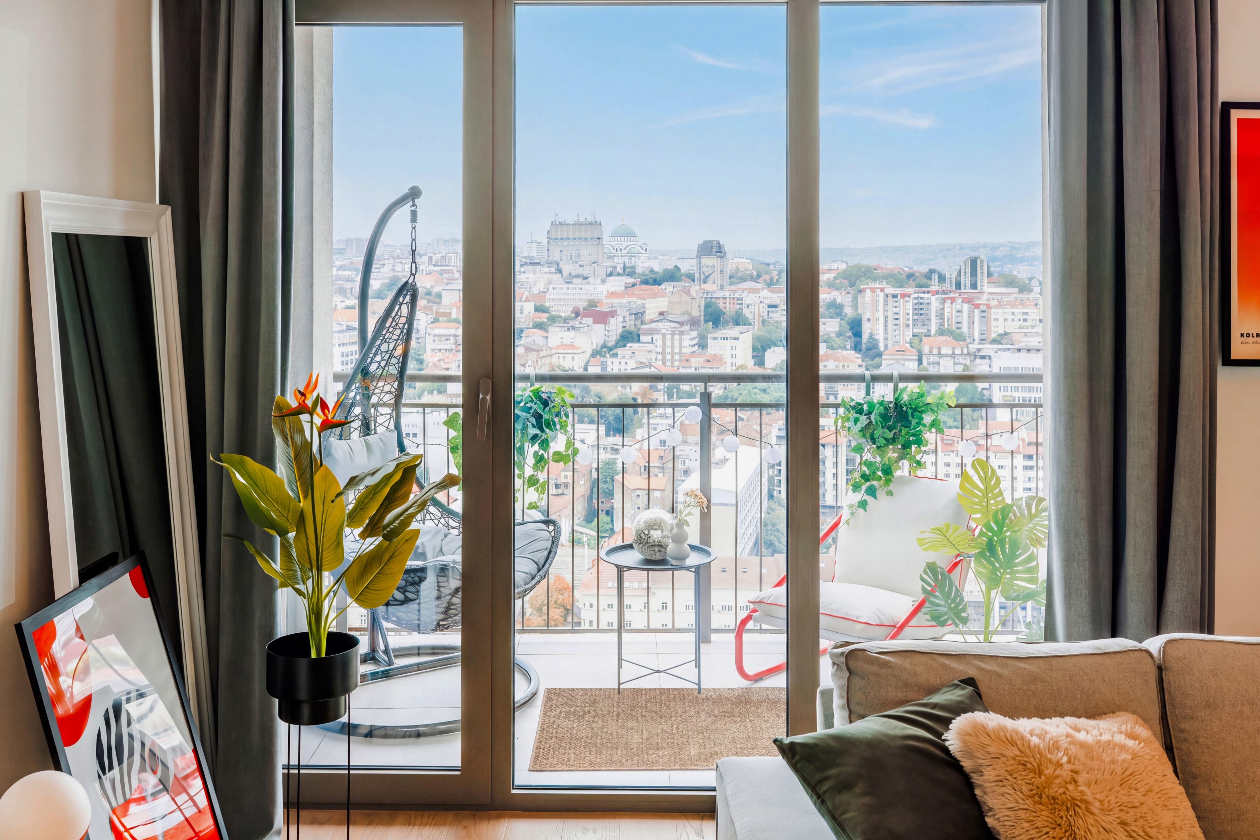 Private balcony with stylish seating and sweeping city views