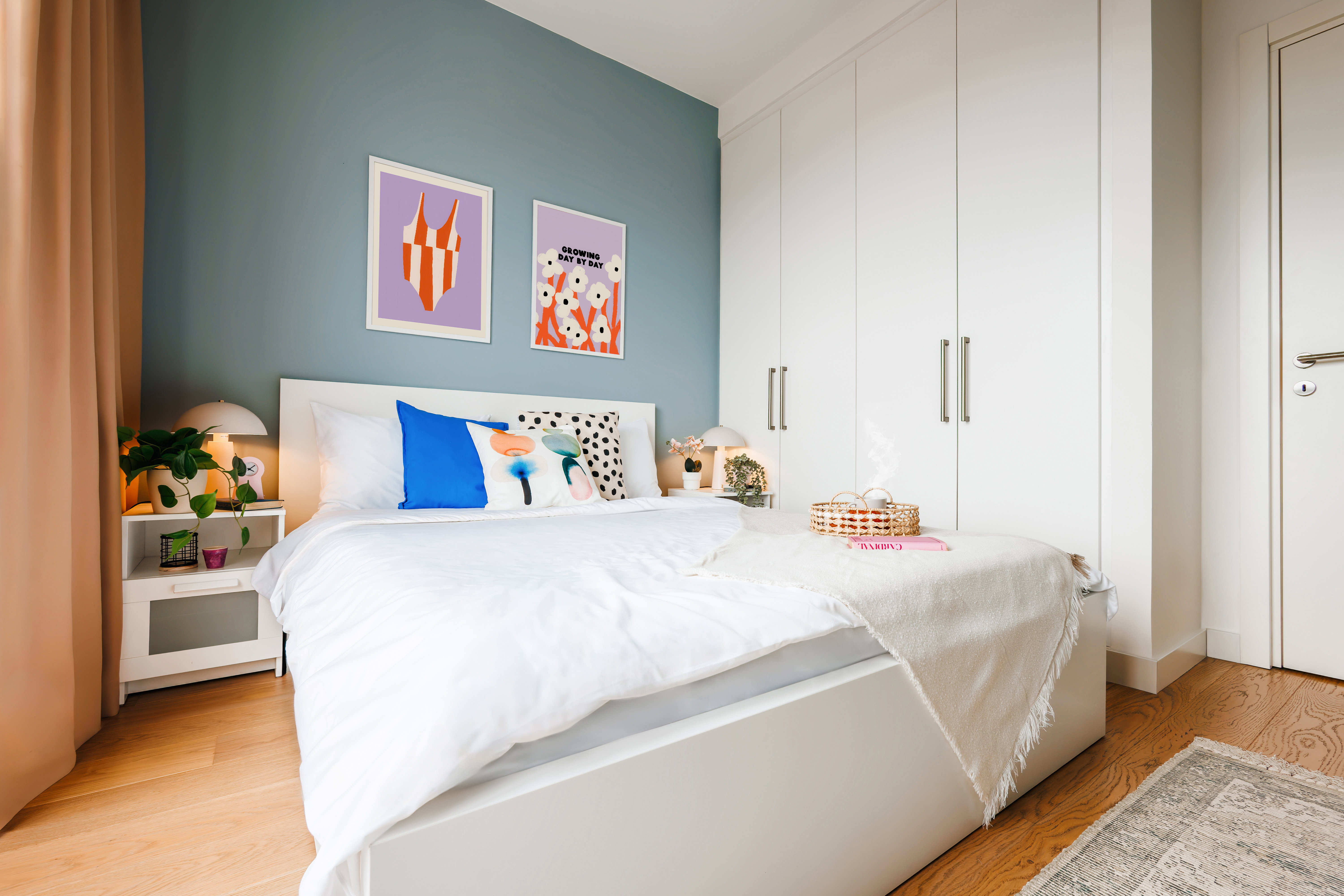Bright modern bedroom with built-in wardrobes and cozy designer touches
