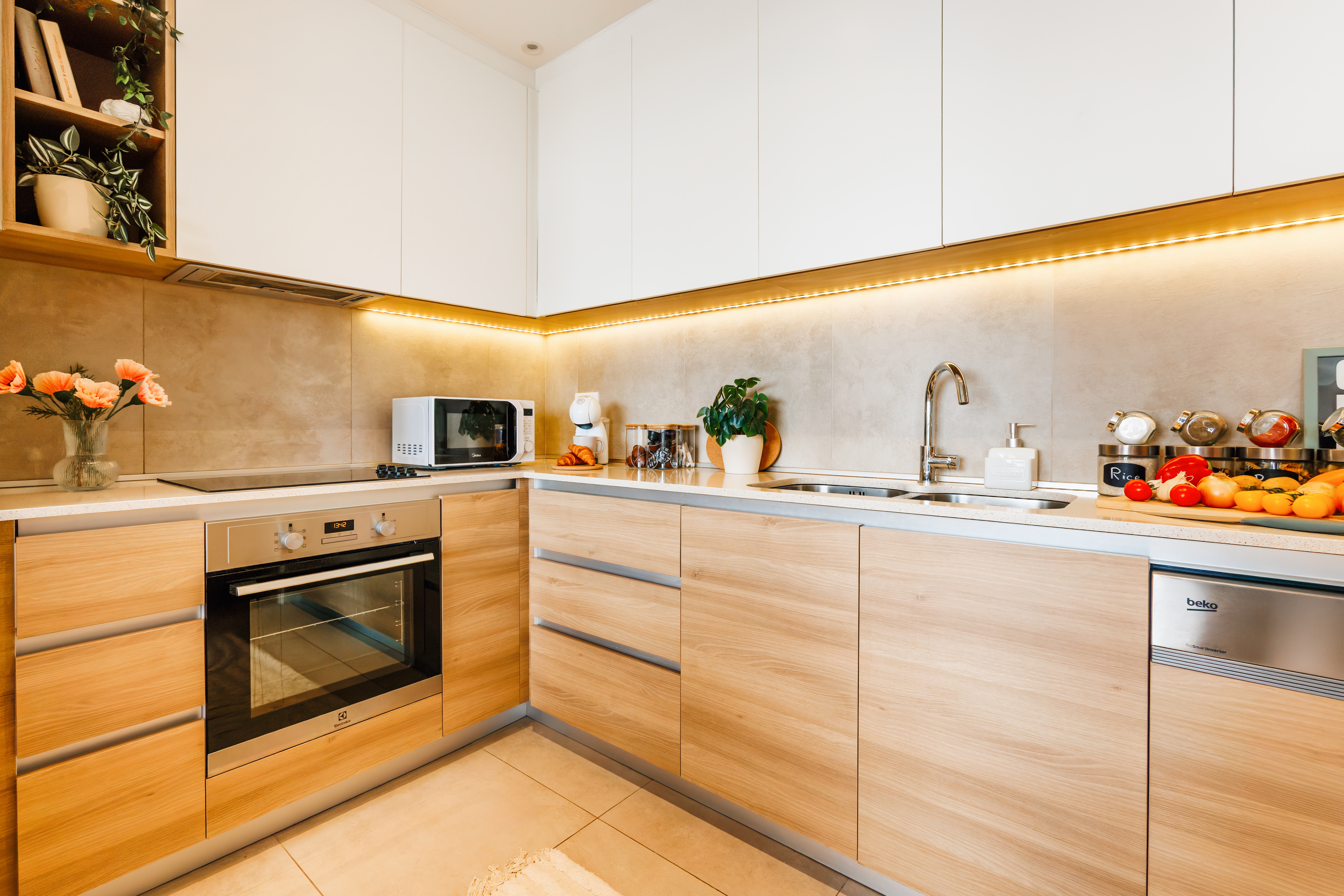 Modern light-filled kitchen with sleek finishes and fully equipped workspace