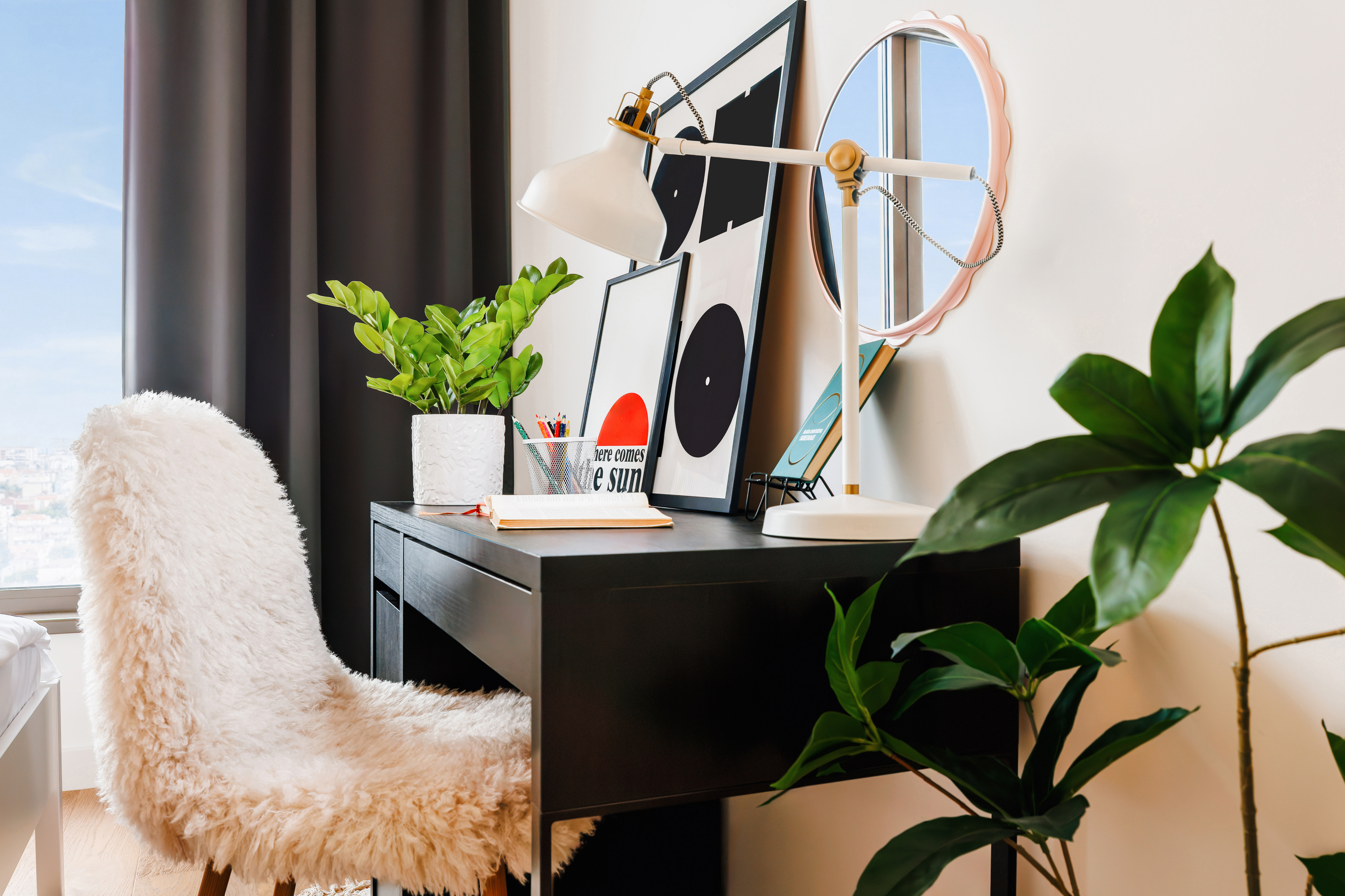 Chic workspace with cozy chair, natural light, and modern decor