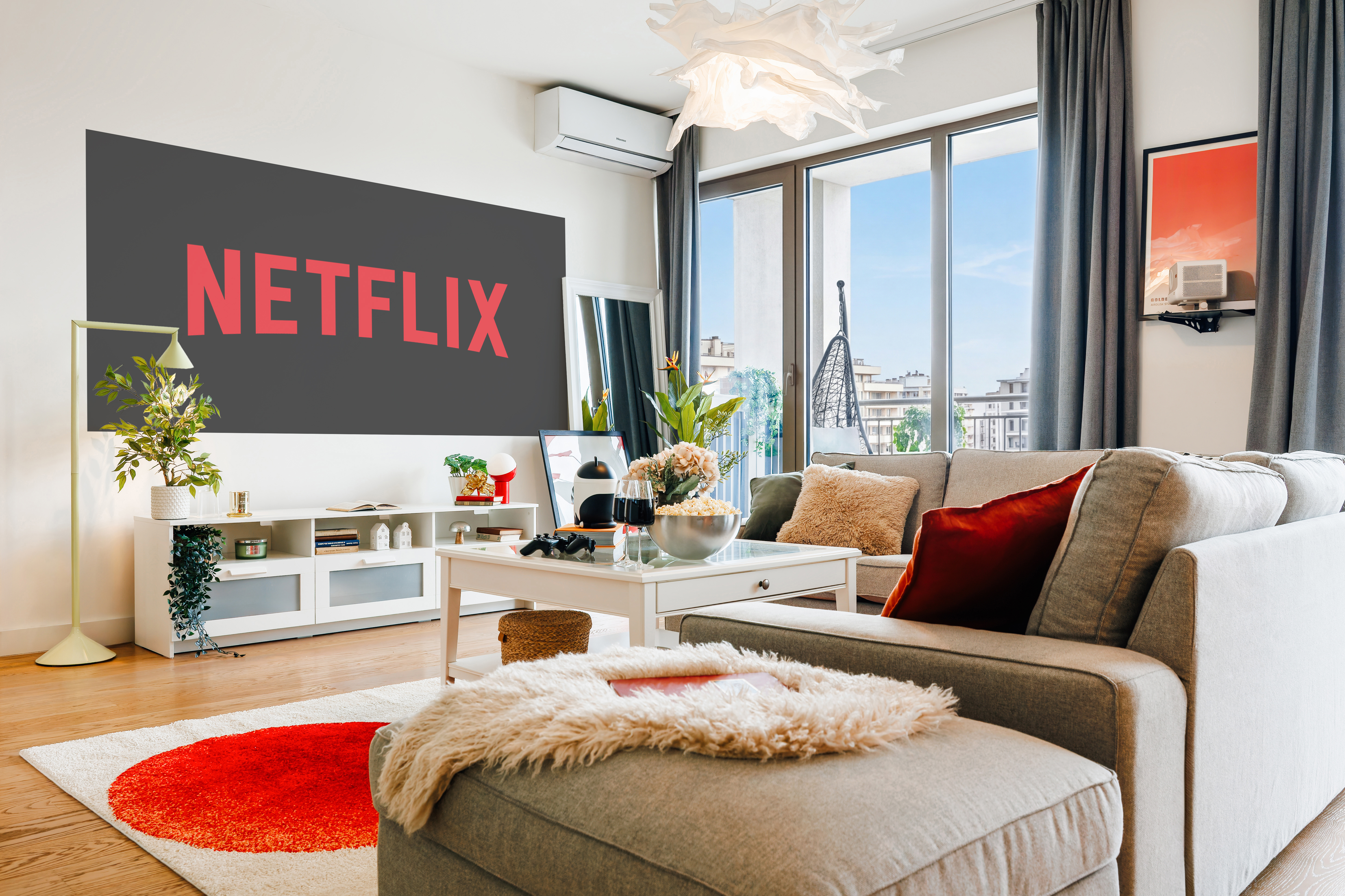 Bright modern lounge with balcony views, cozy seating, and Netflix nights