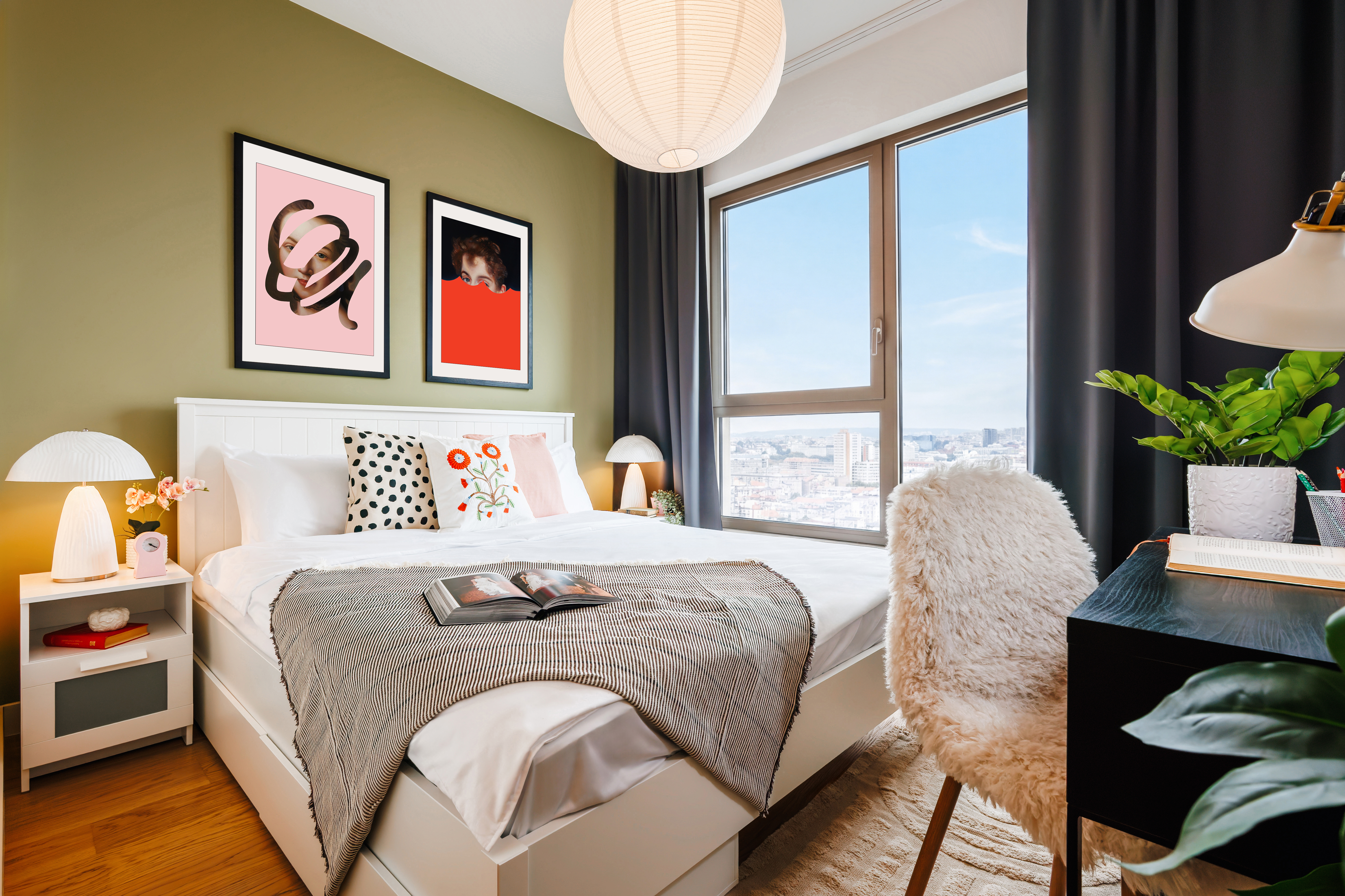 Stylish city-view bedroom with natural light and cozy modern decor