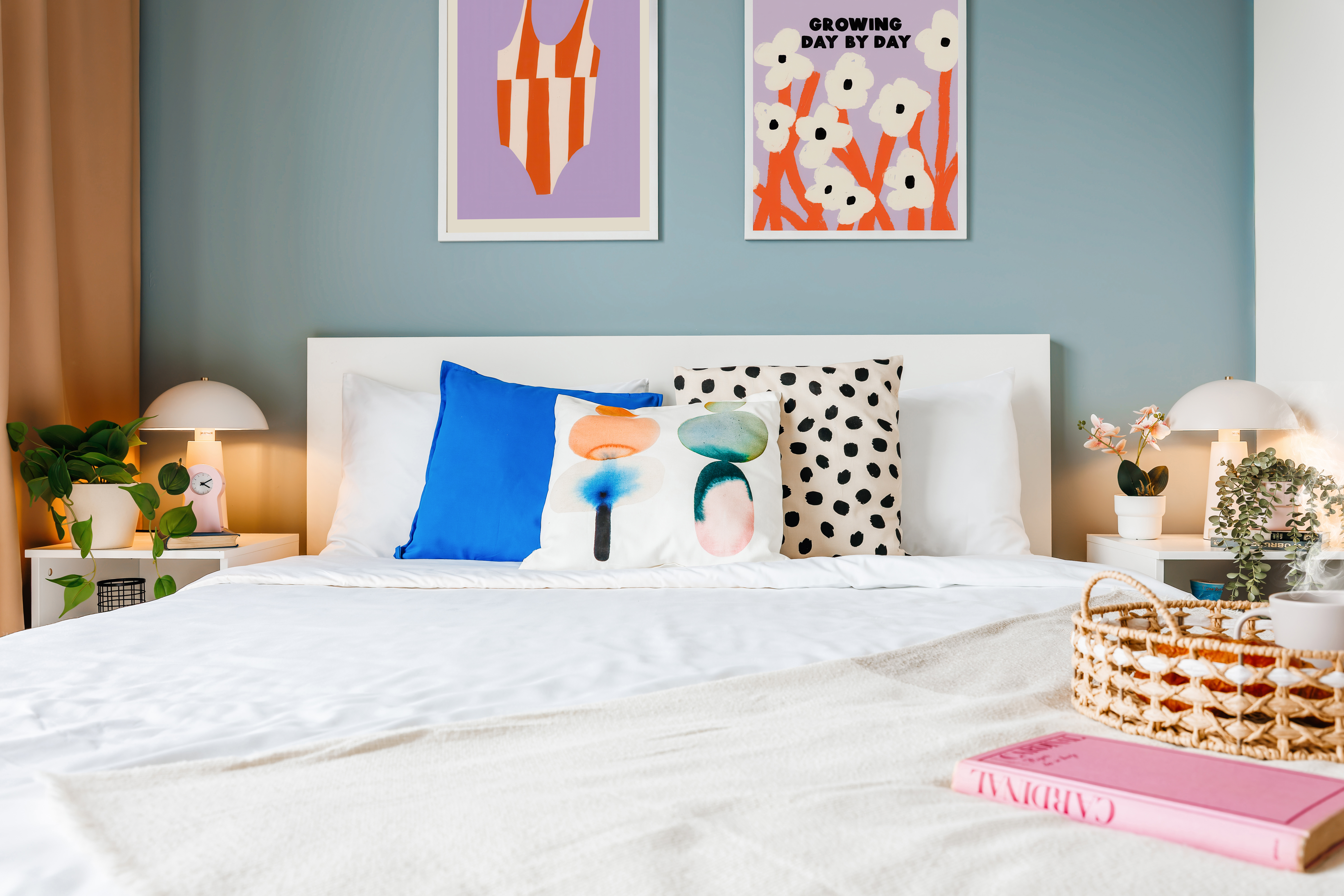Bright, modern bedroom with colorful decor and cozy designer touches