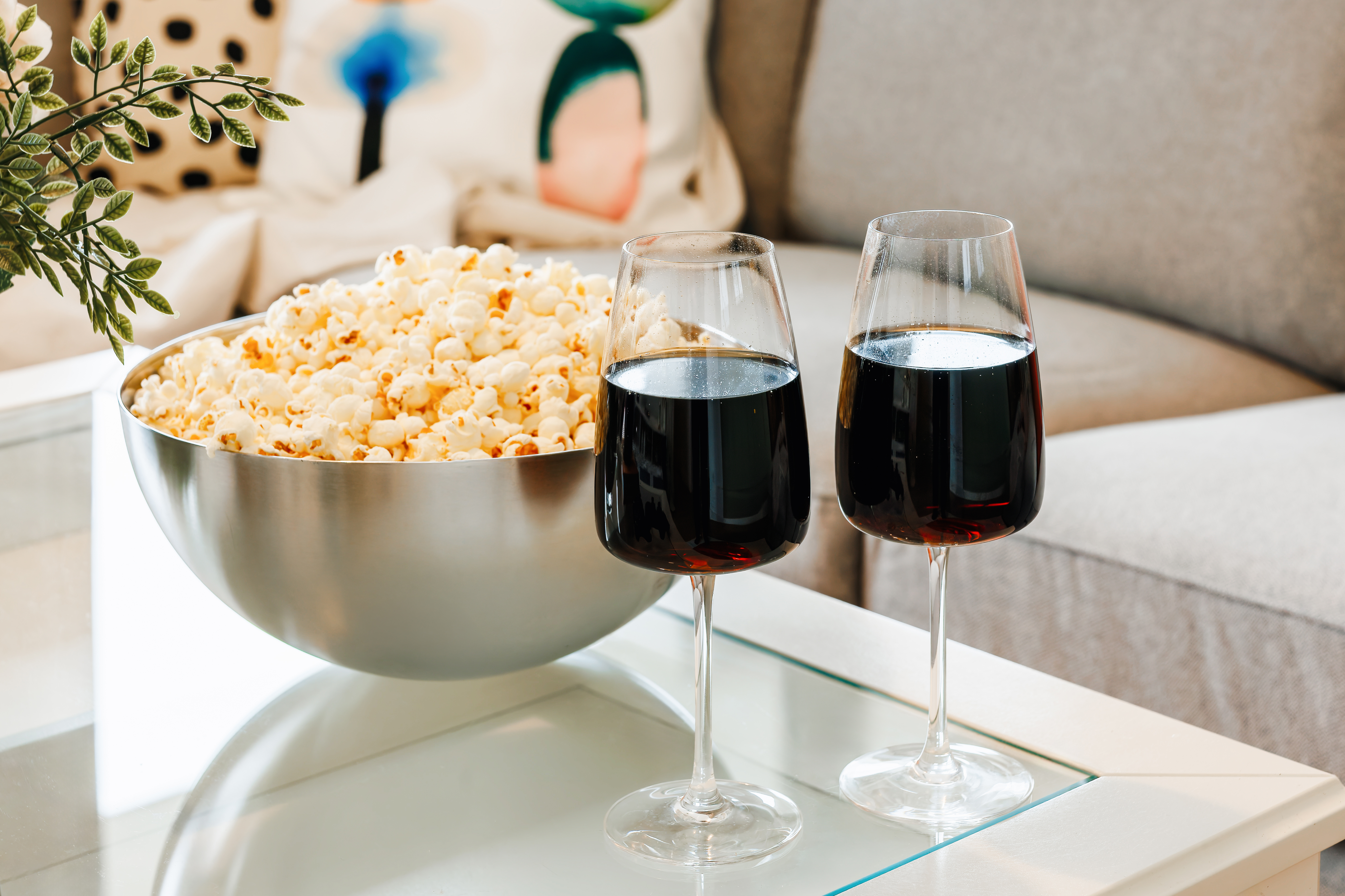 Cozy wine-and-movie night setup in a stylish, inviting living space
