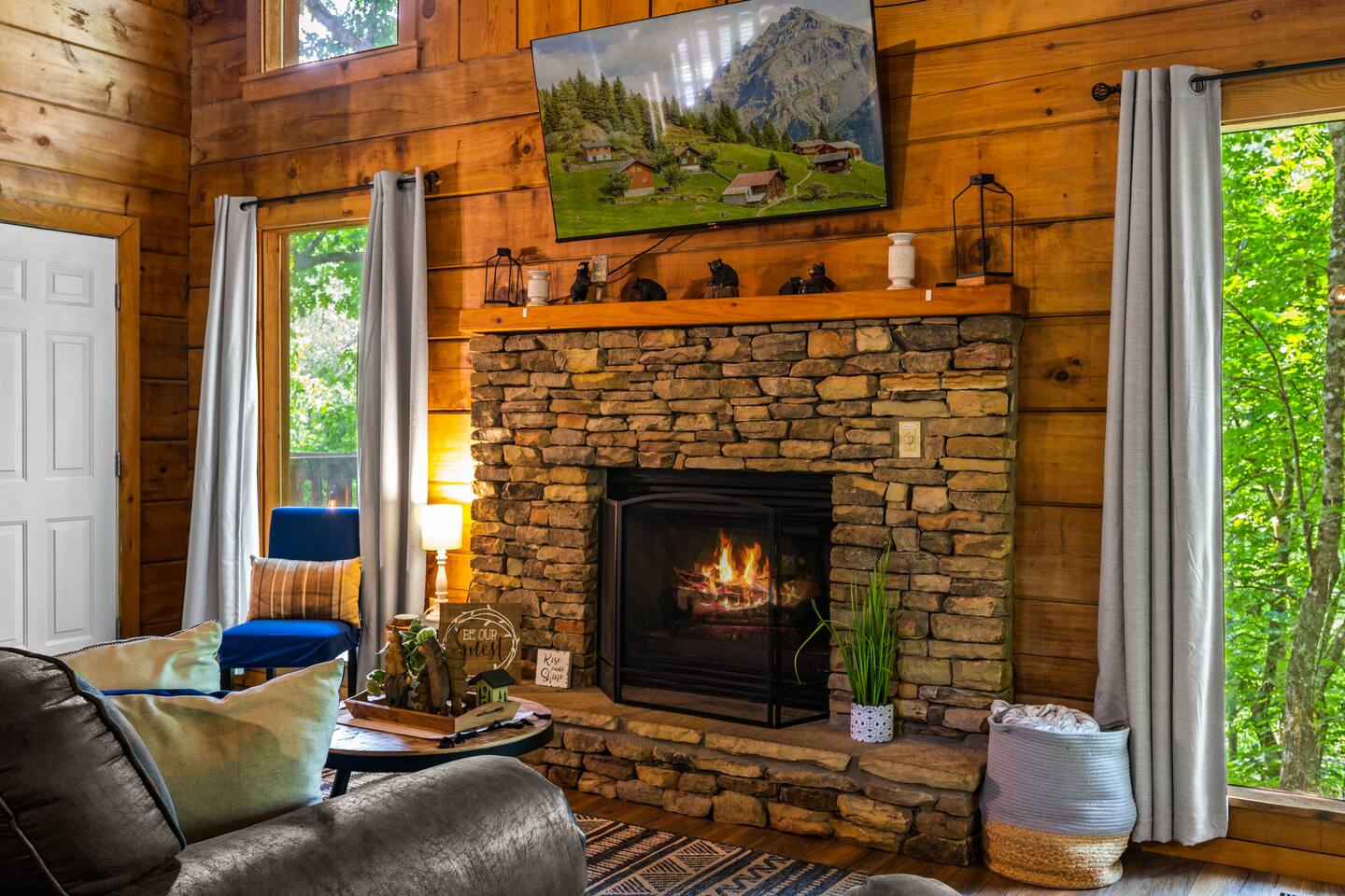 Cozy up by the beautiful stone fireplace, perfect for setting a warm and inviting atmosphere. Whether enjoying a quiet morning or unwinding after a long day, this charming feature adds a touch of rustic elegance to your stay.